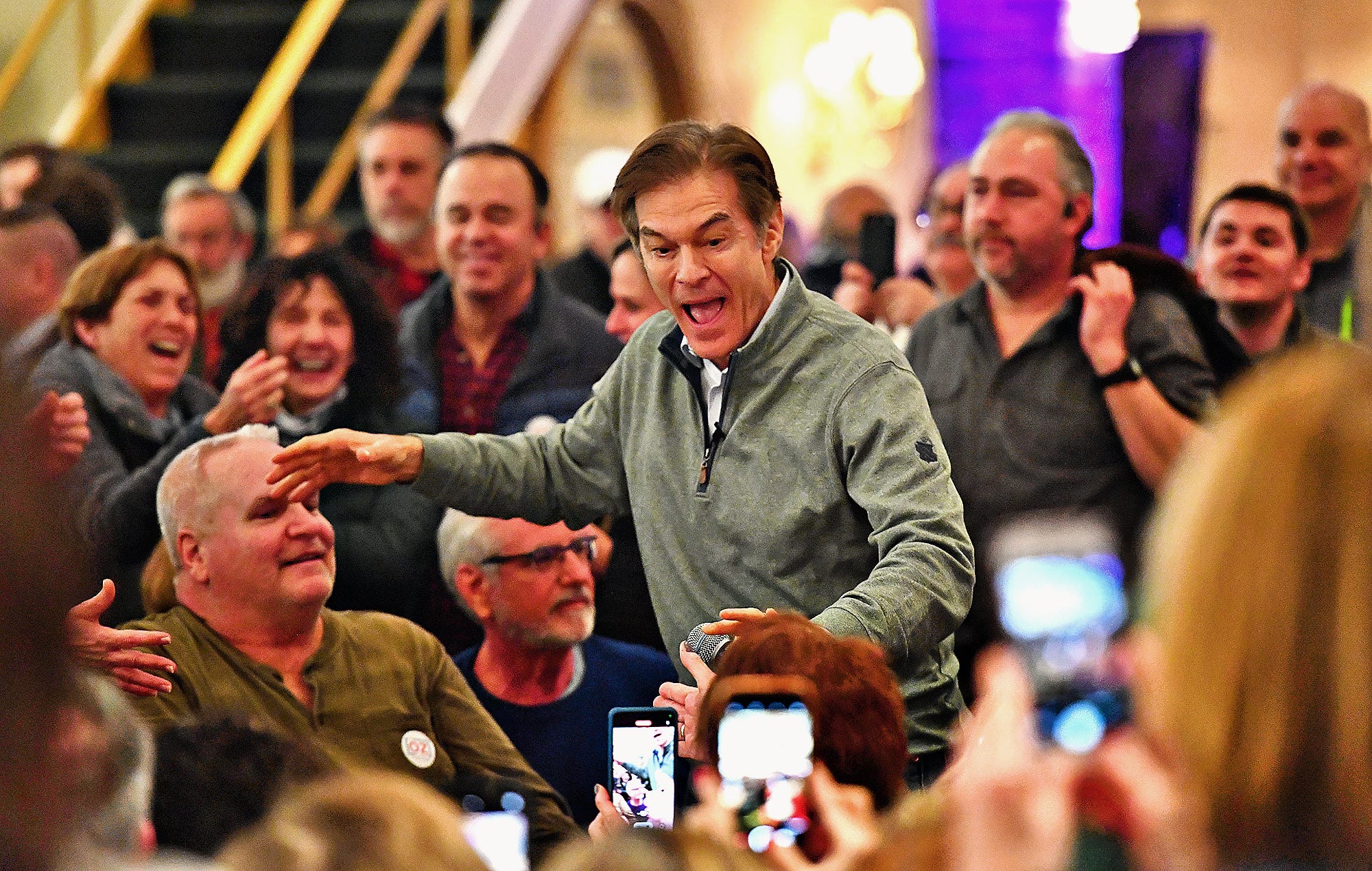 Dr. Mehmet Oz makes his entrance during the Doctor Oz for Senate campaign tour stop at Wisehaven Event Center in Windsor Township, Saturday, Feb. 5, 2022. Dawn J. Sagert photo