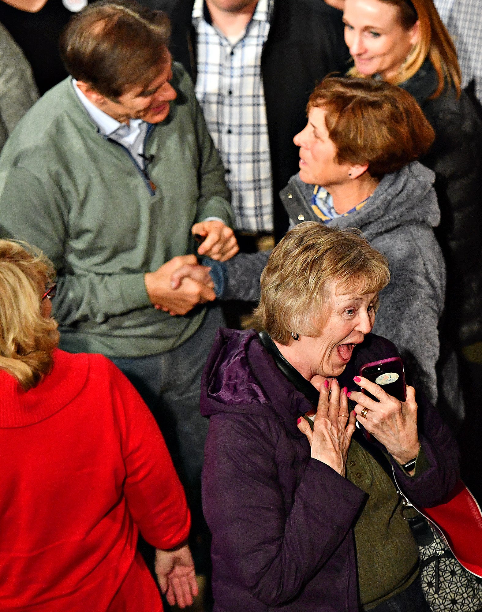 Carol Bair, front, of Manchester Township reacts after taking a selfie with Dr. Mehmet Oz, top left, while Oz greets Rosa Hickey, of West Manchester Township, following the Doctor Oz for Senate campaign event at Wisehaven Event Center in Windsor Township, Saturday, Feb. 5, 2022. Dawn J. Sagert photo