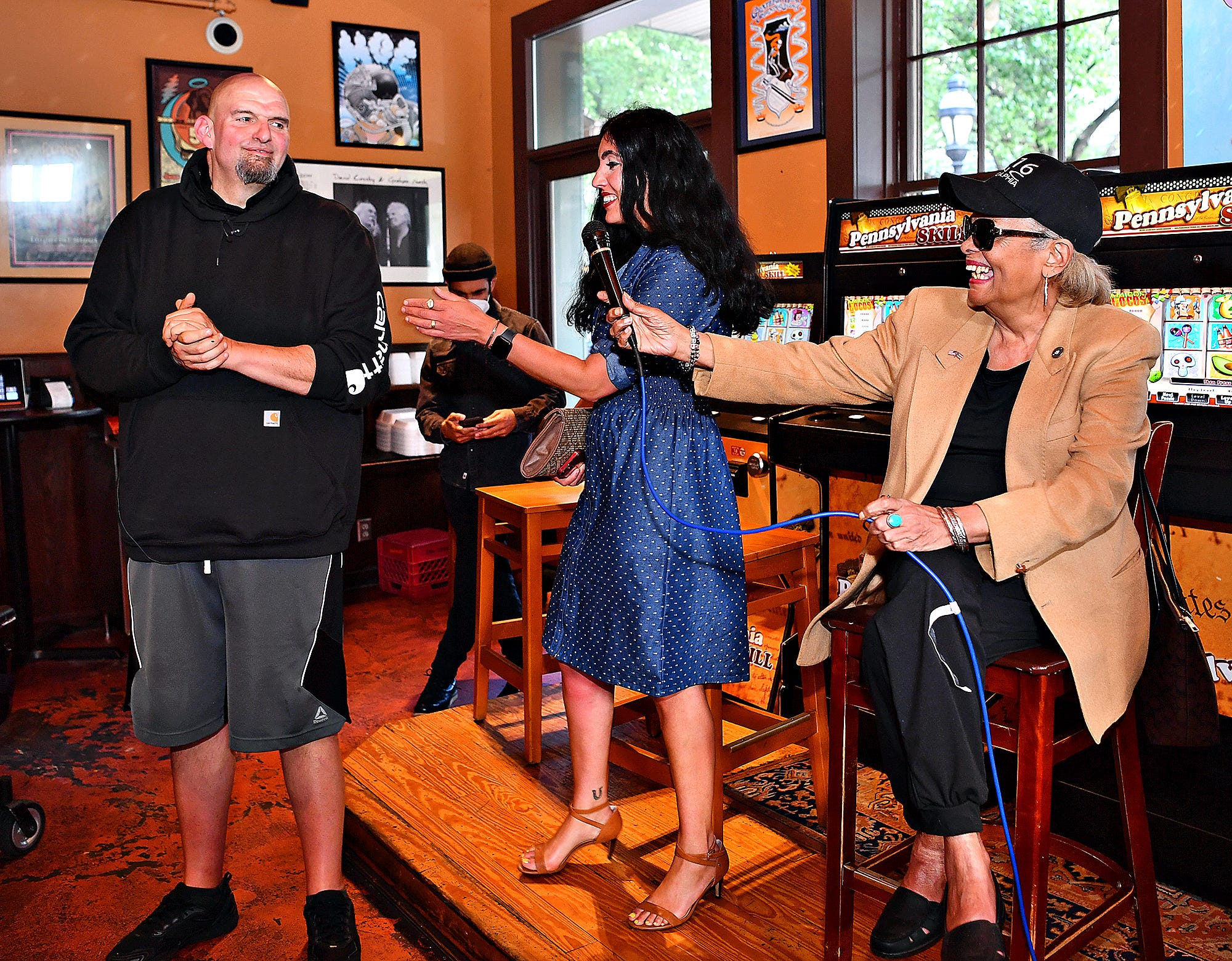 Salome Johnson, right, of Hallam Borough, and Gisele Fetterman share a laugh as Johnson introduces U.S. Senate candidate Lt. Gov. John Fetterman during a campaign stop at Holy Hound Taproom in York City, Thursday, May 12, 2022. Dawn J. Sagert photo