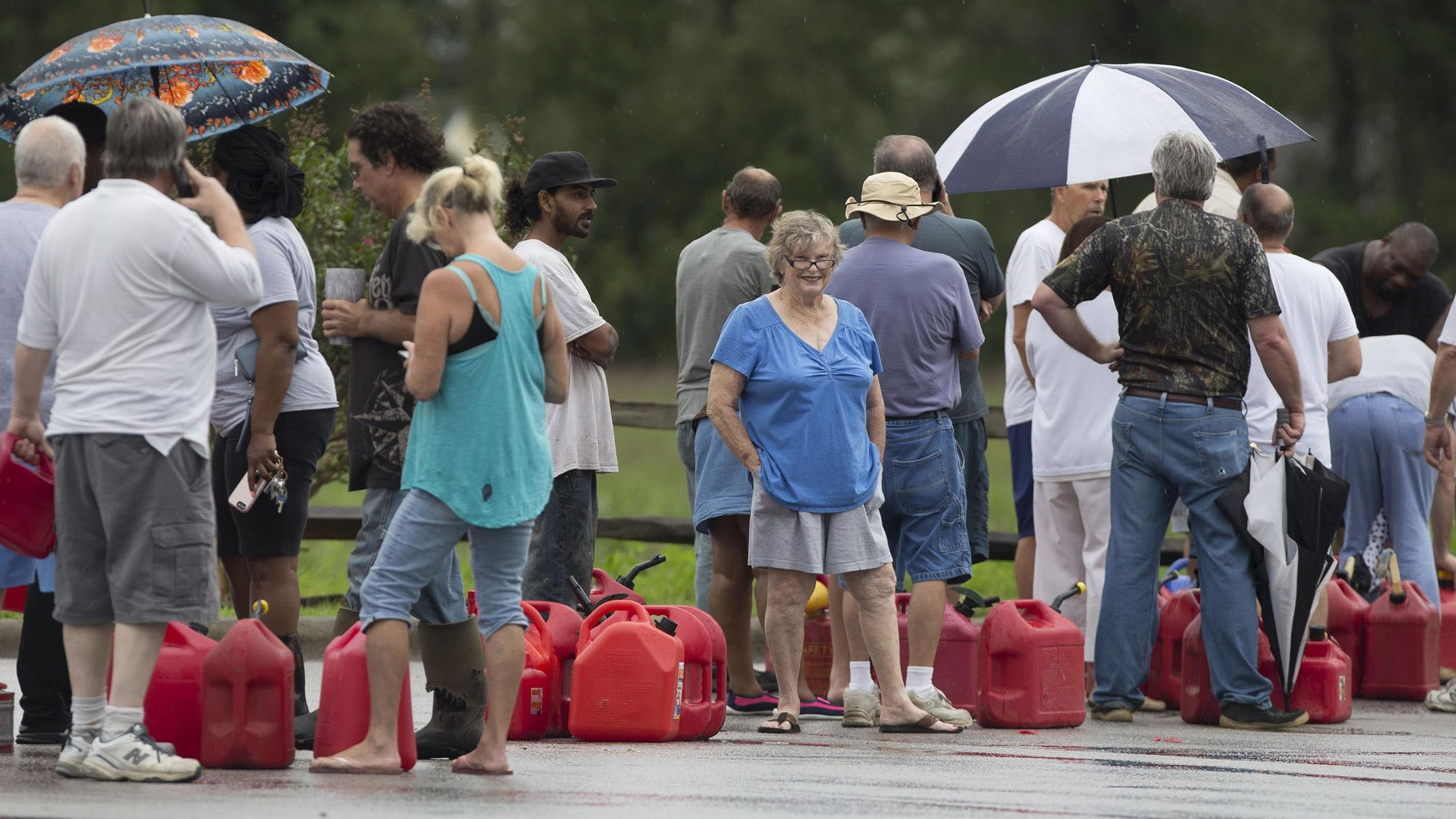 Alice Cooley and her husband, Calvin, of Bridgeton, N.C., wait in line for gasoline at the River Bend Fuel Mart on Saturday, Sept. 15, 2018, in River Bend, N.C. The Cooleys are without power and drove around Craven County looking for gasoline on Friday after Hurricane Florence caused widespread flooding and power outages. (Robert Willett/Raleigh News & Observer/TNS)
