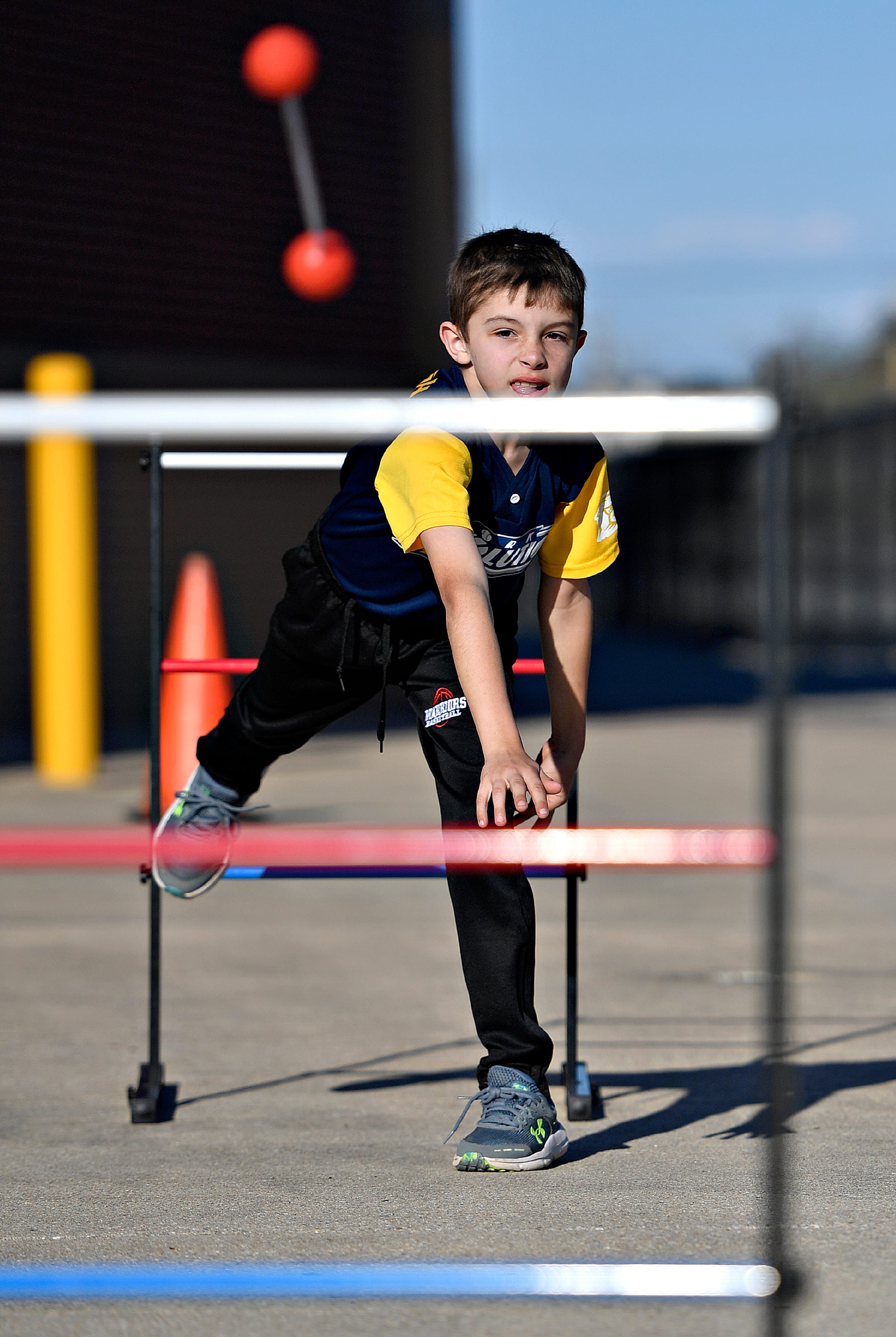 Jason Carbaugh, 9, of Codorus Township, plays ladder ball during York Revolution’s Fan Fest in the Brooks Robinson Plaza at WellSpan Park in York City, Saturday, April 20, 2024. (Dawn J. Sagert/The York Dispatch)