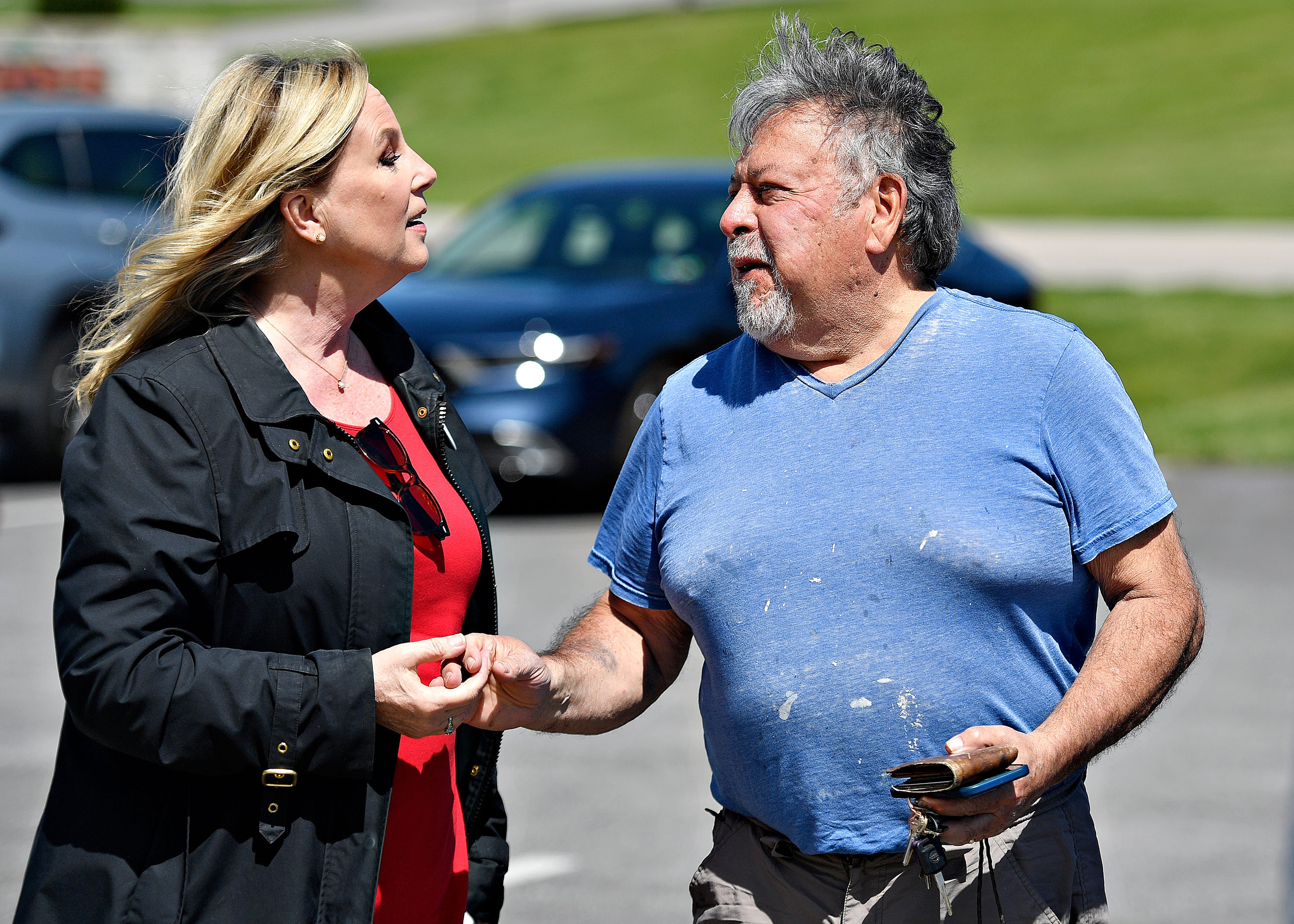 Janelle Stelson, Democratic candidate for the 10th Congressional District, left, greets voter Dennis Carrington, of Manchester Township, as he arrives just after work to cast his vote at the Manchester Township Building during Primary Election Day in Manchester Township, Tuesday, April 23, 2024. (Dawn J. Sagert/The York Dispatch)