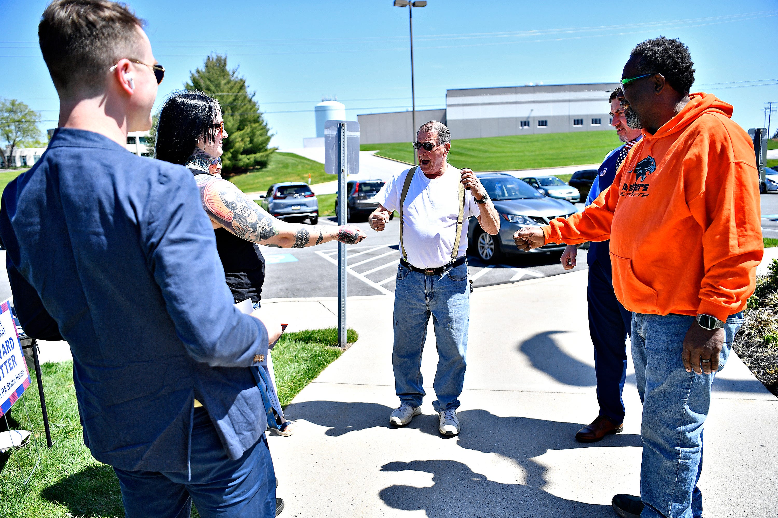Richard Helfrich, of Manchester Township, talks to candidates and stumpers during Primary Election Day outside of Precinct 4 in Manchester Township, Tuesday, April 23, 2024. (Dawn J. Sagert/The York Dispatch)