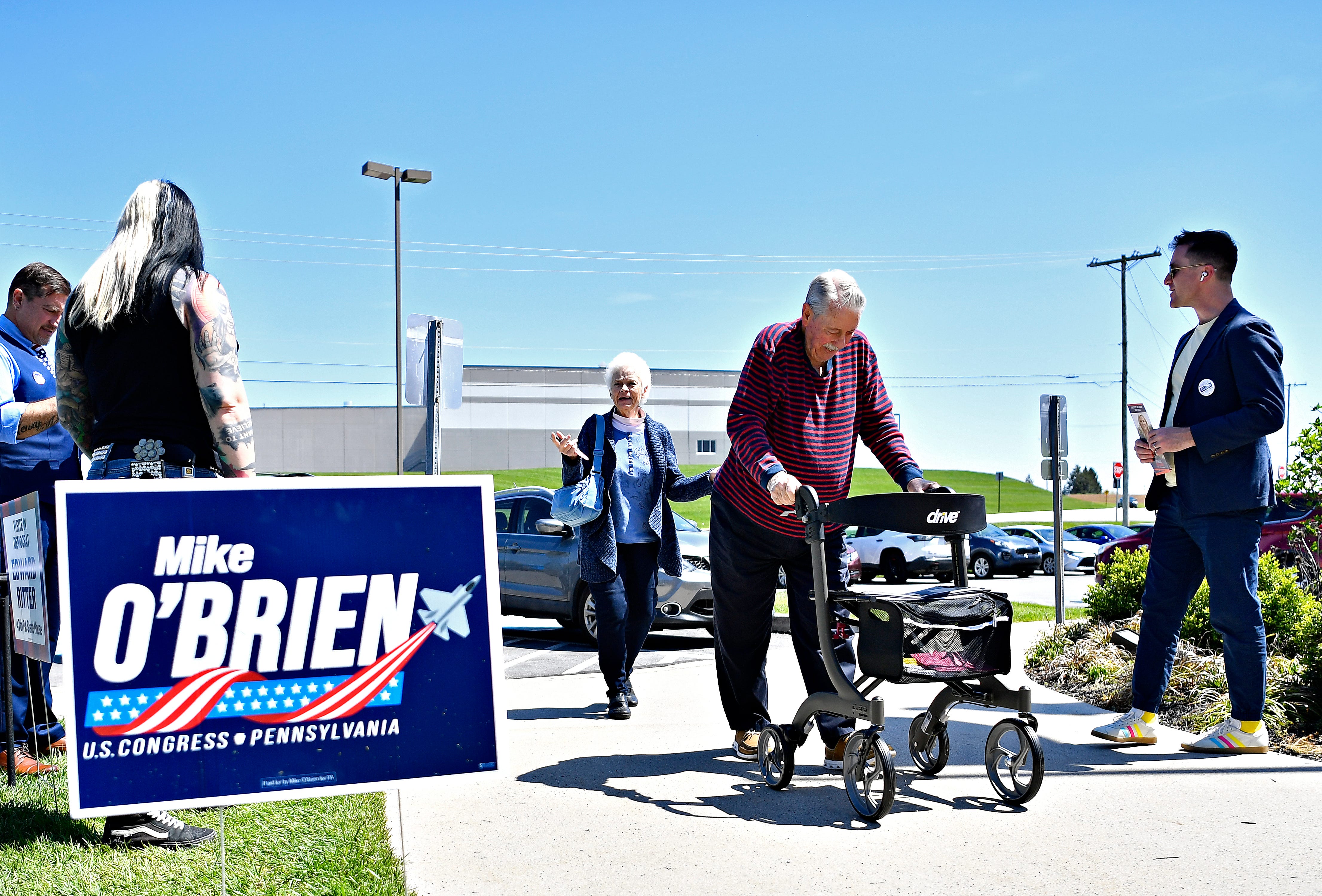 Galen Riggs, front center, and RoJean Riggs, both of Manchester Township, arrive at the Manchester Township building to cast their votes during Primary Election Day in Manchester Township, Tuesday, April 23, 2024. (Dawn J. Sagert/The York Dispatch)