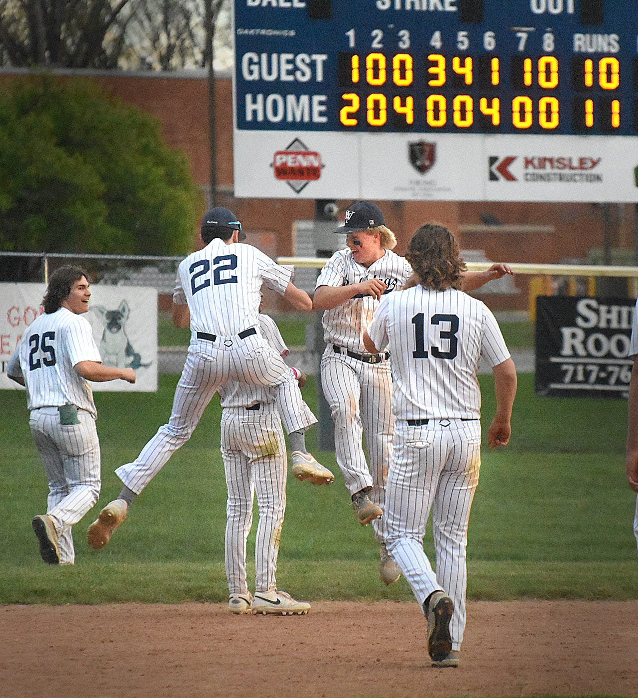 West York players celebrate after scoring the winning run in the ninth inning against Littlestown in a York-Adams Division III baseball game Wednesday, April 24, 2024, at Sunset Lane Park in West Manchester Township.