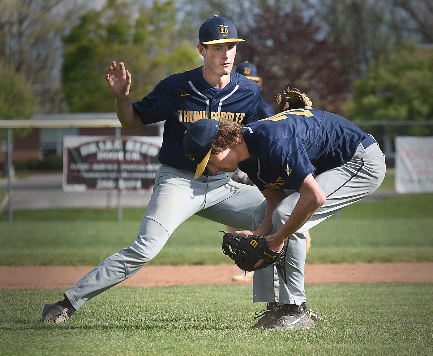 Two Littlestown defenders converge on a ground ball during a York-Adams Division III baseball game against West York on Wednesday, April 24, 2024, at Sunset Lane Park in West Manchester Township. West York walked off with an 11-10 win in nine innings.