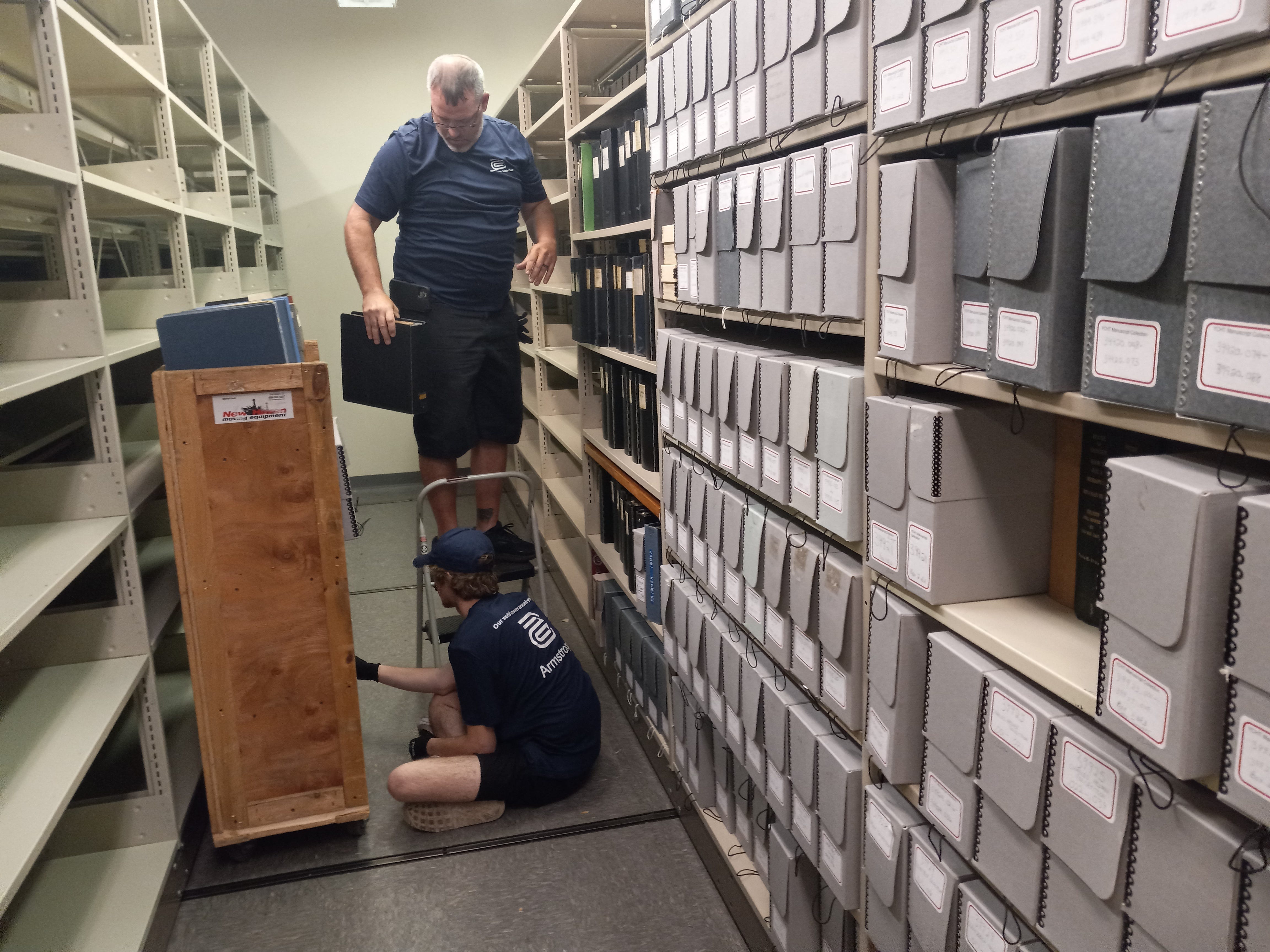 Workers take down archived material from a shelf at the old York County History Center on East Market Street in York City. The move of all the archived material should be completed by next week.