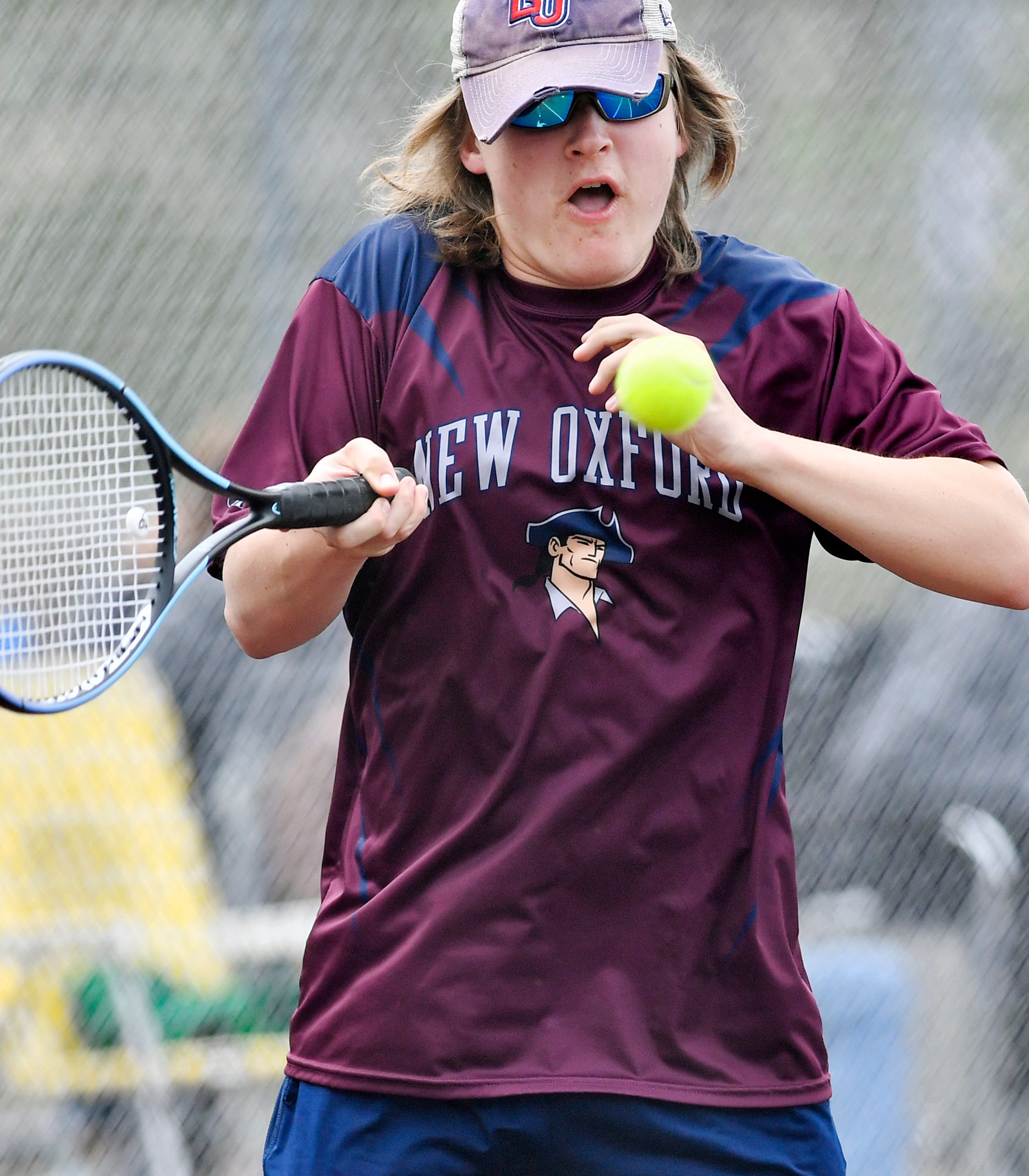 New Oxford’s Luke Malinowski during YAIAA boys’ 3A singles tennis tournament action at Red Lion Area Senior High School in Red Lion, Thursday, April 25, 2024. (Dawn J. Sagert/The York Dispatch)