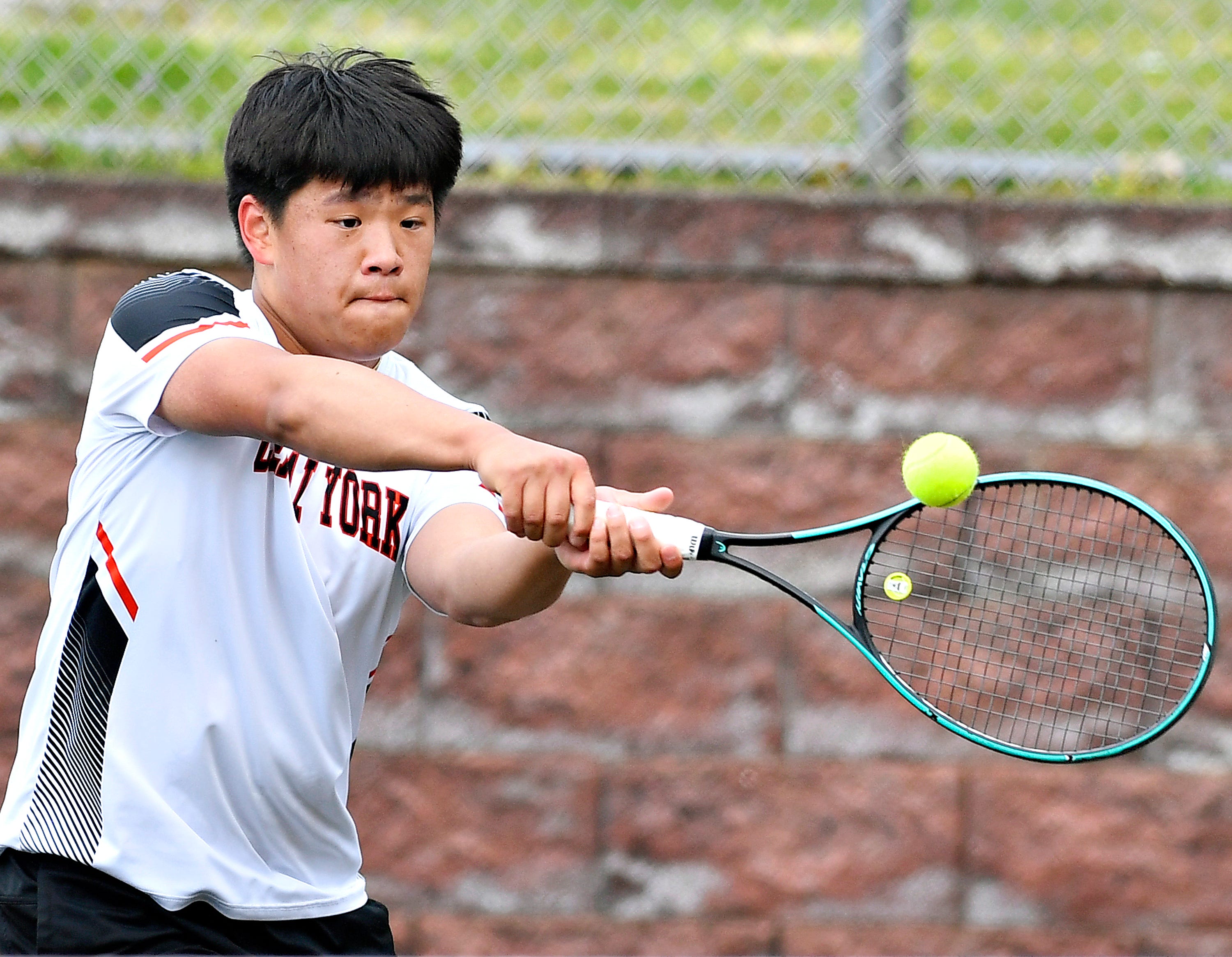 Central York’s Andrew Gao during YAIAA boys’ 3A singles tennis tournament action at Red Lion Area Senior High School in Red Lion, Thursday, April 25, 2024. (Dawn J. Sagert/The York Dispatch)