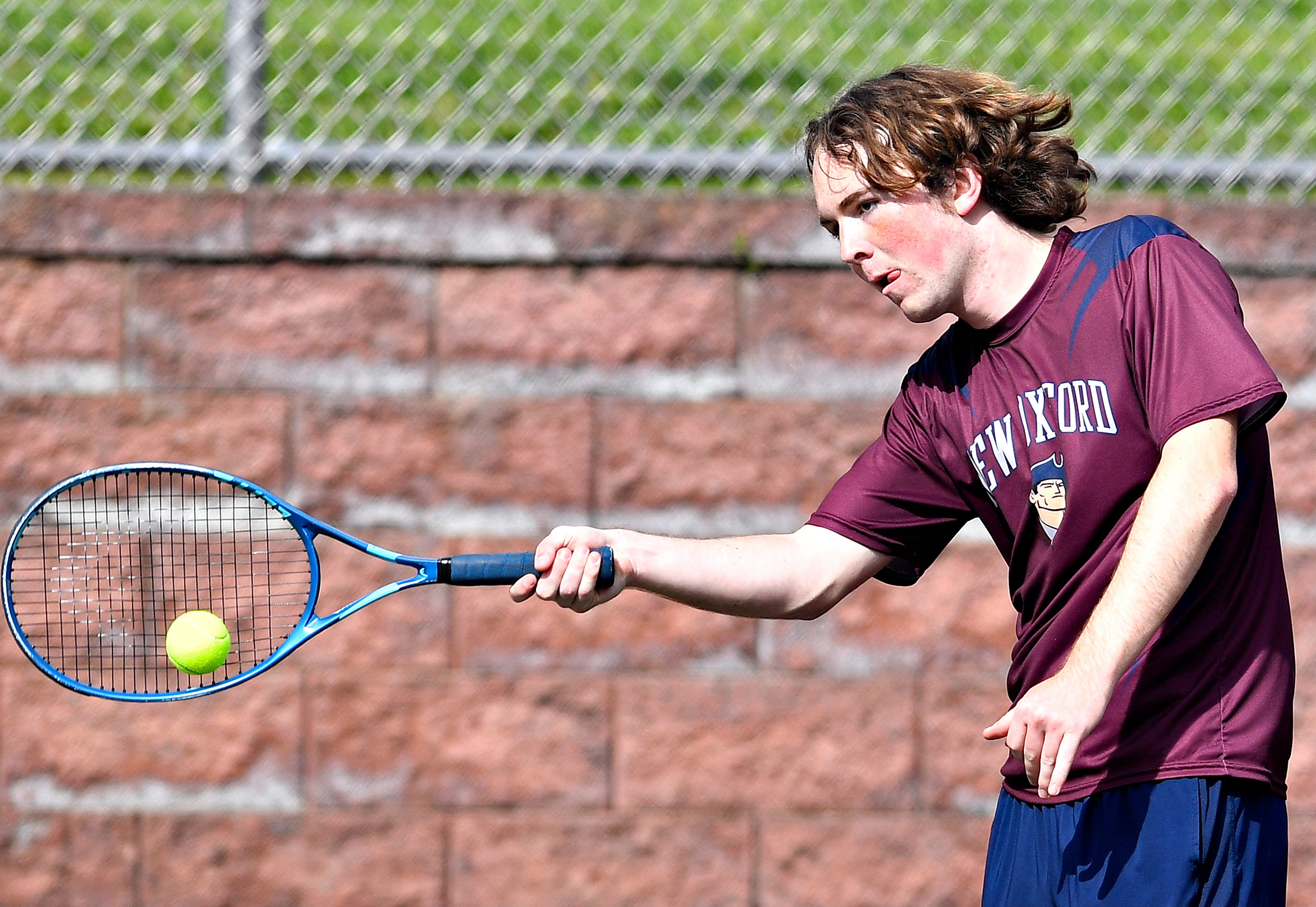 New Oxford’s Blaine Paris during YAIAA boys’ 3A singles tennis tournament action at Red Lion Area Senior High School in Red Lion, Thursday, April 25, 2024. (Dawn J. Sagert/The York Dispatch)