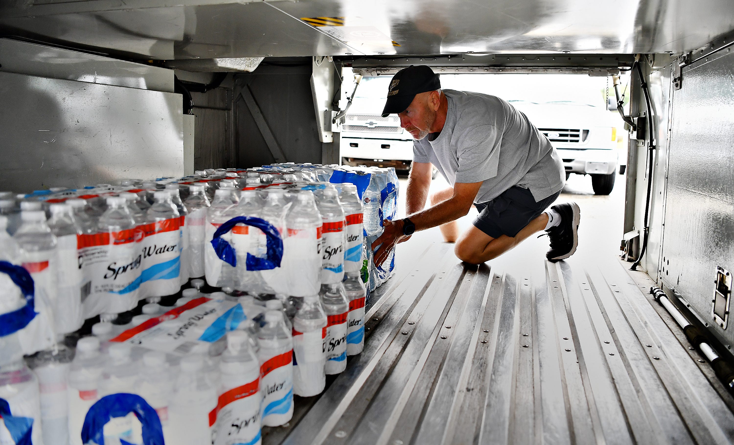 Volunteer Don Reichard, of West Manchester Township, works with other volunteers and employees to collect and load donations of non-perishable items and toiletries at Bailey Coach in West Manchester Township, Tuesday, Sept. 11, 2018. The items will be delivered to areas that are projected to be in the path of Hurricane Florence. Dawn J. Sagert photo