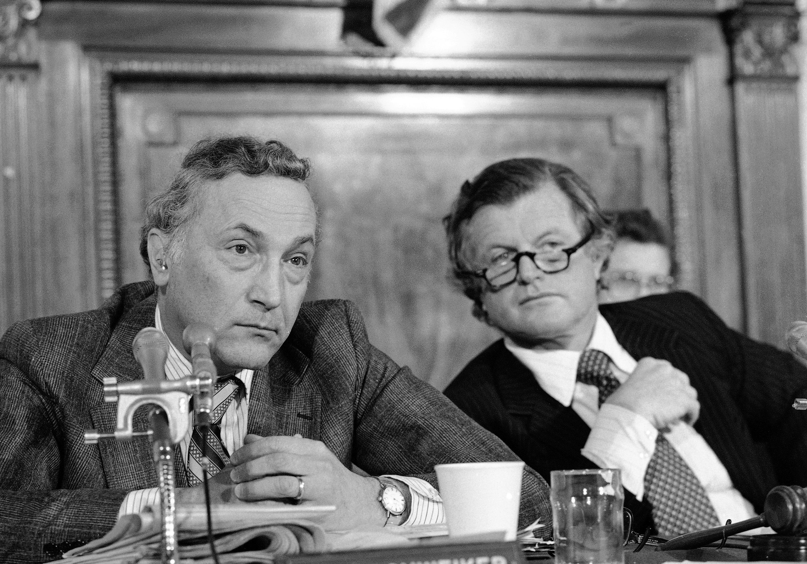 Sen. Richard Schweiker, R-Pa., left, and Edward Kennedy, D-Mass., members of a Senate Health and Scientific Research subcommittee, confer during a meeting of the panel Wednesday, April 4, 1979 in Washington. The group is probing the nuclear accident at Three Mile Island nuclear power plant in Pennsylvania. (AP Photo/Charles Harrity)