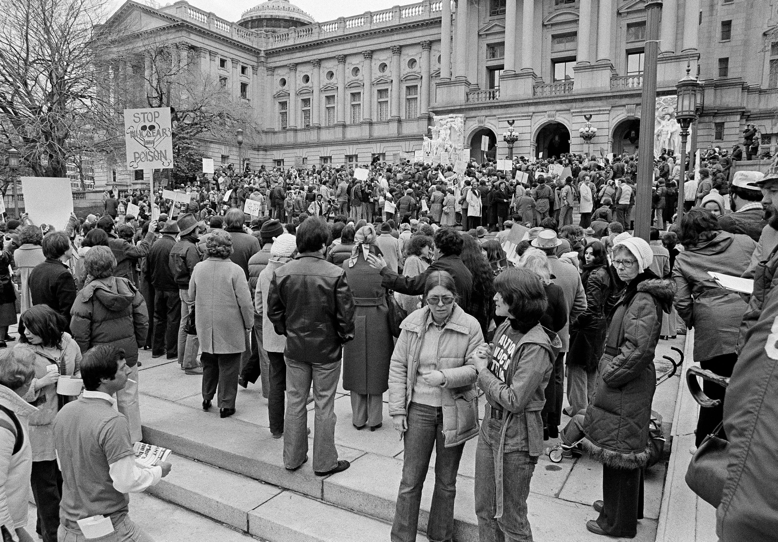Anti-nuclear power plant demonstrators mass on the front steps of the State Capitol in Harrisburg, Penn., April 8, 1979, urging a shut-down of Three Mile Island nuclear power plant. The plant had an accident, causing radiation to leak into the atmosphere. (AP Photo/Paul Vathis)
