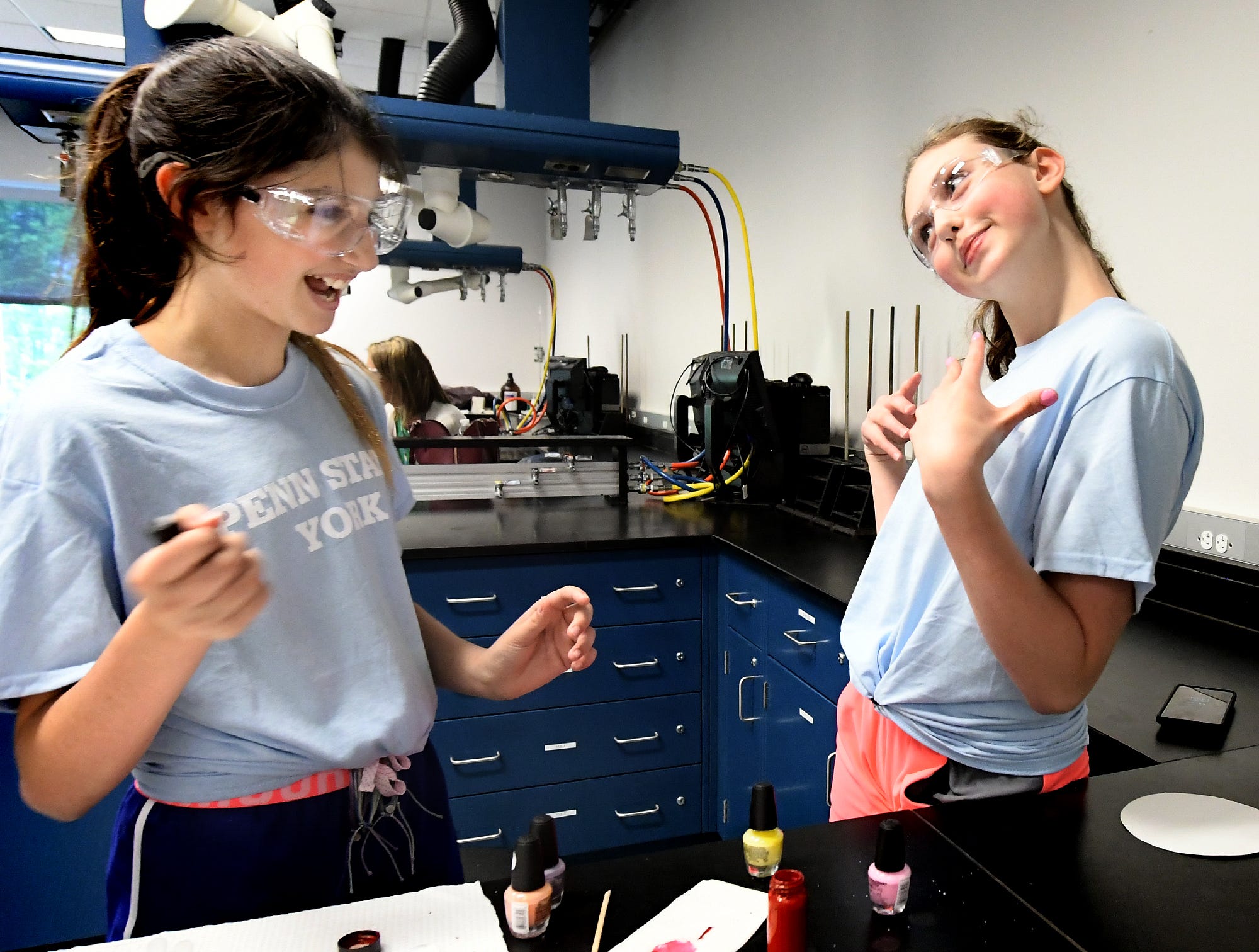 Dallastown Middle School student Elliot Post-Kulisiewicz shows off the nail polish she applied to classmate Emerson Dunker, left, during The Science of Color in Cosmetics workshop at the Pathways to Your Future: Exploring STEAM Careers event at Penn State York Friday, May 10, 2019. Over 200 seventh-grade girls from 28 area schools participated in the program which highlighted science, technology, engineering, art, and mathematics (STEAM) careers. Industry leaders administered the workshops during the program, which is in its 23rd year. Bill Kalina photo