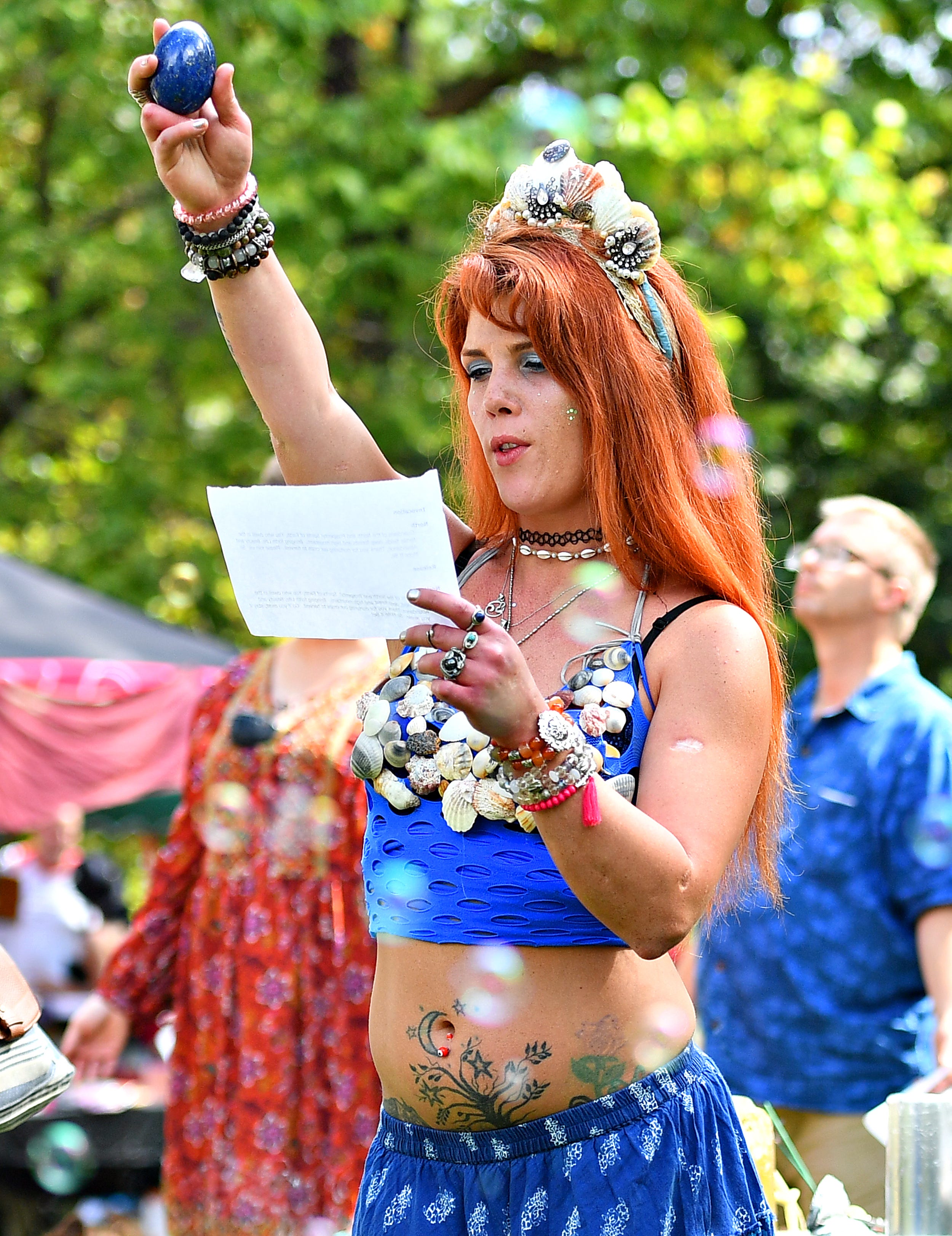 Laura Webster, of Dillsburg, speaks to one of the four elements as part of a harvest ritual, or blessing, during the 8th annual Pagan Pride Festival at Samuel S. Lewis State Park in Lower Windsor Township, Saturday, Sept. 28, 2019. Dawn J. Sagert photo