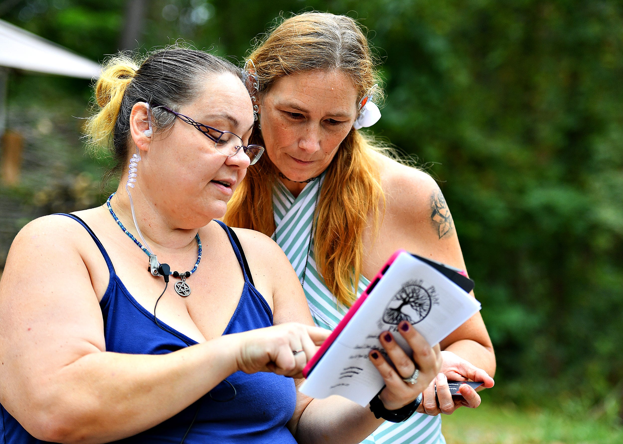 Event organizer Sabrina Bowman, left, works with a volunteers during the 8th annual Pagan Pride Festival at Samuel S. Lewis State Park in Lower Windsor Township, Saturday, Sept. 28, 2019. Dawn J. Sagert photo