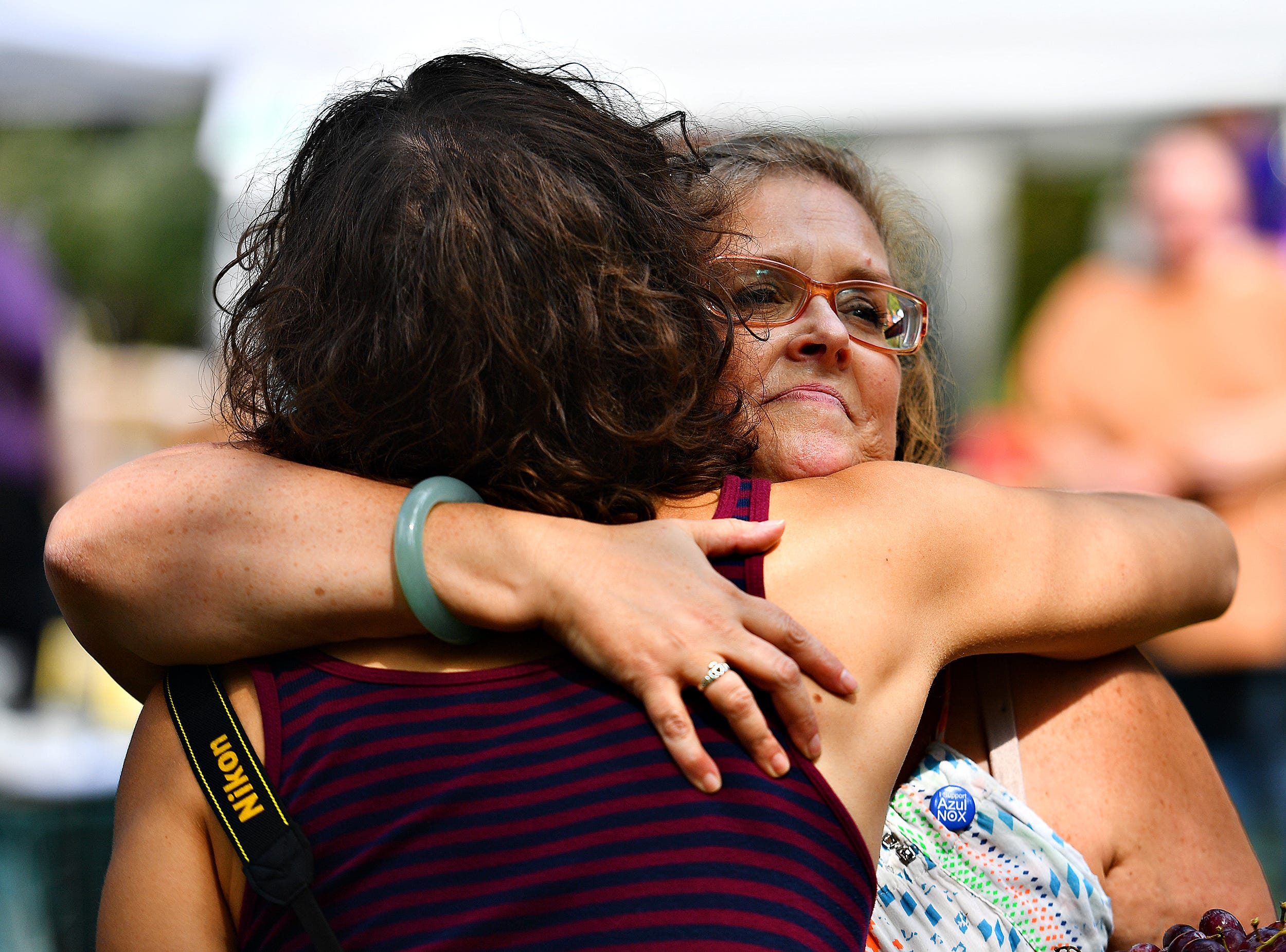 Rev. Shawnee Frasca, of Hellam Township, hugs participant Melanie Gorguny as a harvest ritual is performed as the main ritual of the day, to honor both the harvest time of year and to cultivate community, during the 8th annual Pagan Pride Festival at Samuel S. Lewis State Park in Lower Windsor Township, Saturday, Sept. 28, 2019. Dawn J. Sagert photo