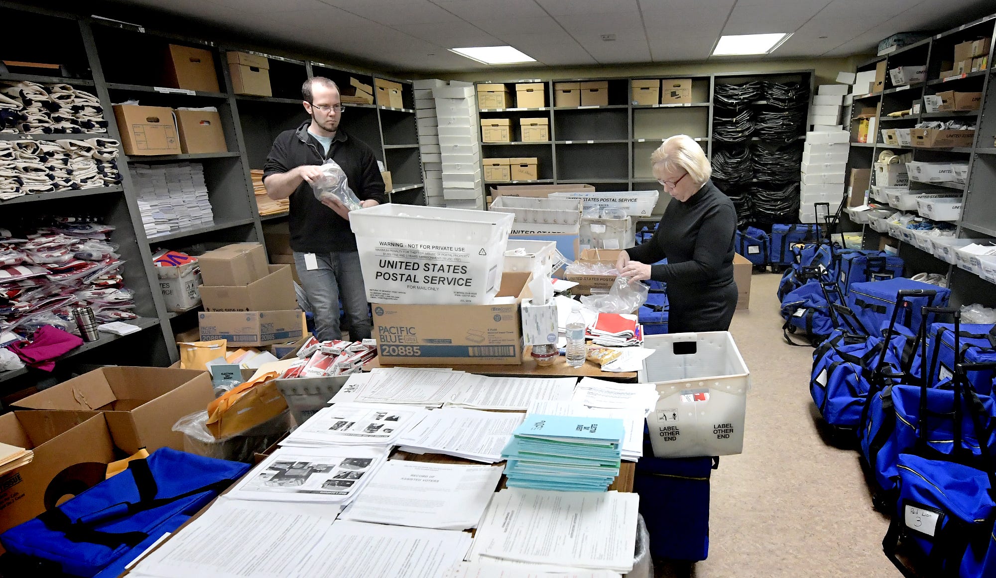 Temporary county workers Derek Kennell and Doris Feeser sort and store items returned from polling sites at the Elections and Voters Office at the York County Administration Building Thursday, November 7, 2019. The final vote tally was released earlier that morning after glitches with the new voting procedure on Tuesday delayed the count. Bill Kalina photo