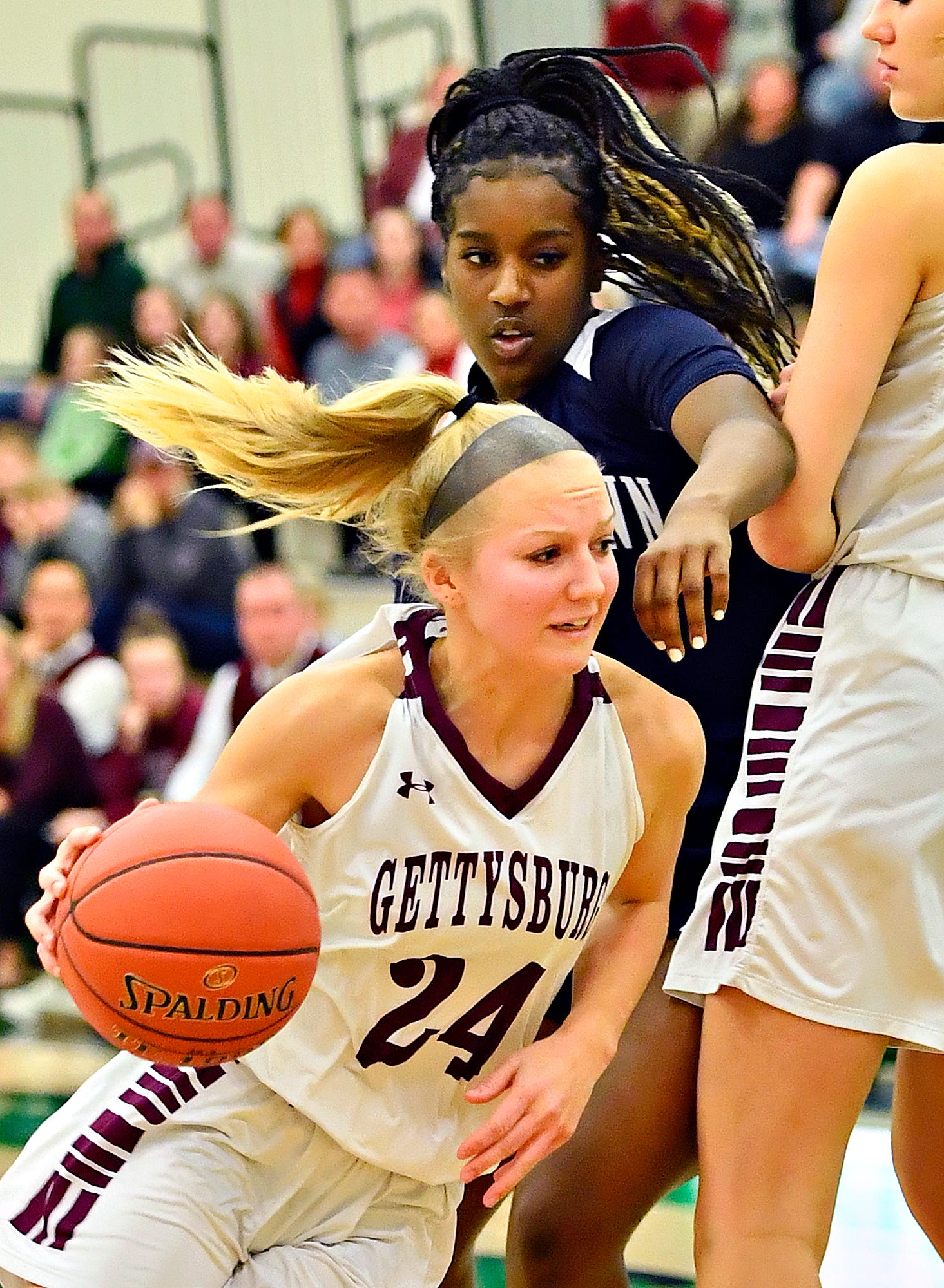 Gettysburg's Anne Bair, left, drives the ball past Dallastown's D'Shantae Edwards during YAIAA girls' basketball championship action at Grumbacher Sport and Fitness Center at York College of Pennsylvania in Spring Garden Township, Friday, Feb. 14, 2020. Dawn J. Sagert photo