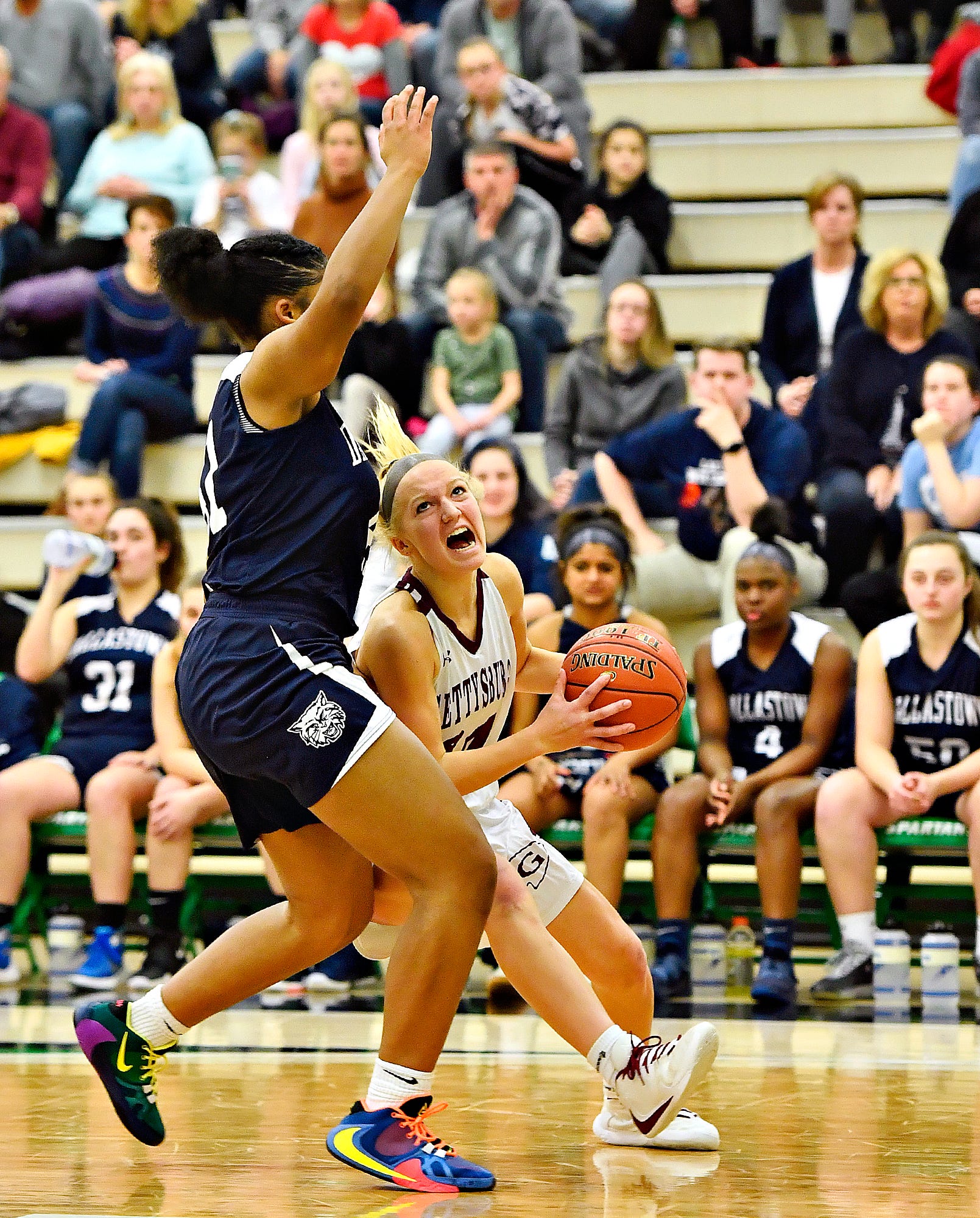 Gettysburg's Anne Bair, right, works to get around Dallastown's Bria Beverly during YAIAA girls' basketball championship action at Grumbacher Sport and Fitness Center at York College of Pennsylvania in Spring Garden Township, Friday, Feb. 14, 2020. Dallastown would win the game 42-38. Dawn J. Sagert photo