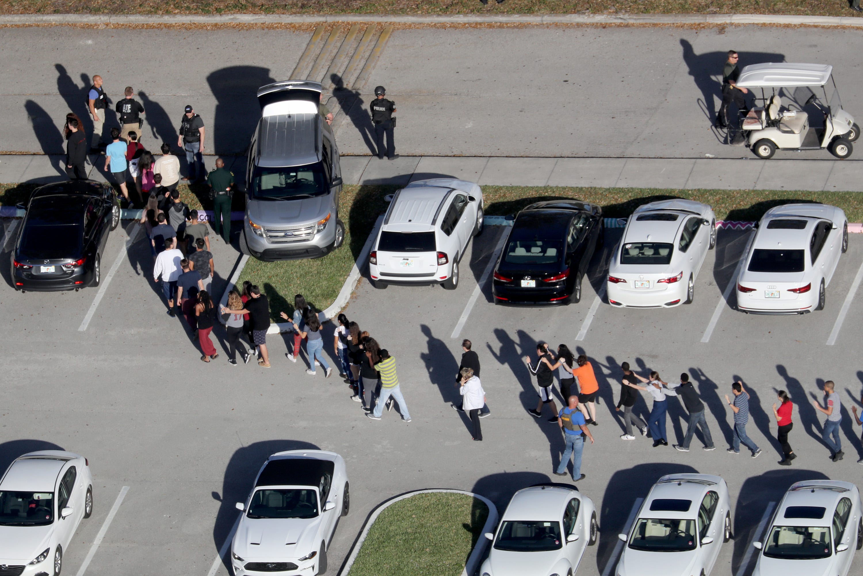 Students are evacuated by police out of Stoneman Douglas High School in Parkland, Florida, after a shooting on Wednesday, February 14, 2018. (Mike Stocker/Sun Sentinel/TNS)