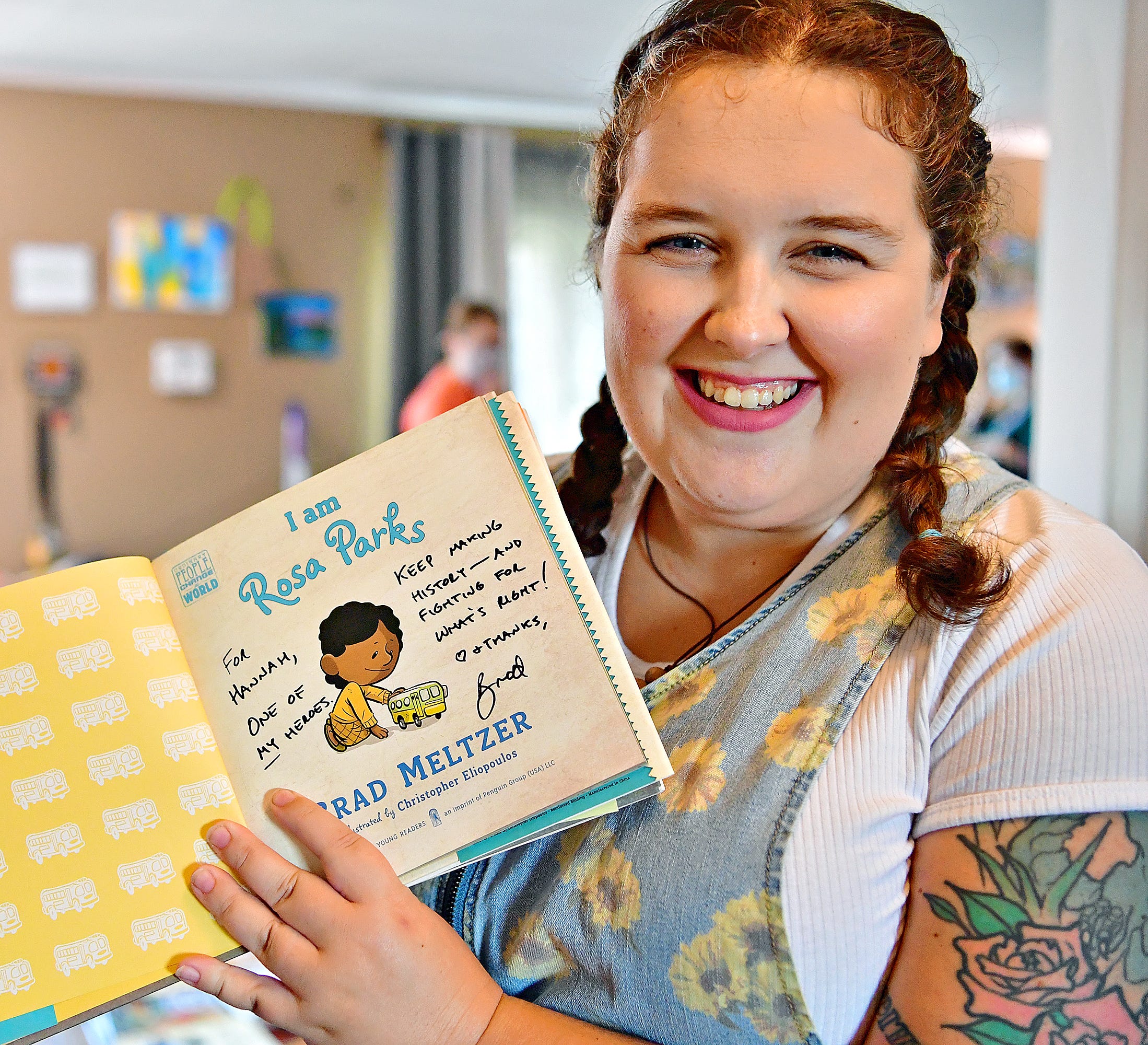 Hannah Shipley is shown with a signed copy of, "I am Rosa Parks" by Brad Meltzer, at her home in West Manchester Township, Thursday, Sept. 23, 2021. Meltzer shared Shipley's post on social media promoting her wish list, comprised of Central School District's banned resources, which included Meltzer's books. To date, Shipley has received about half of the 4,500 books that have been purchased. Dawn J. Sagert photo