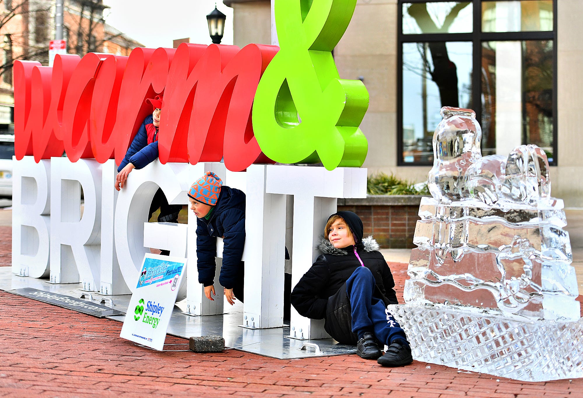 Sophia Pineda, 9, right, Eduard Pineda, 7, both of North York Borough, and Oliver Markowski, 8, of Manchester Township, pose for photos during the 8th annual FestivICE event in downtown York City, Saturday, Jan. 15, 2022. Dawn J. Sagert photo