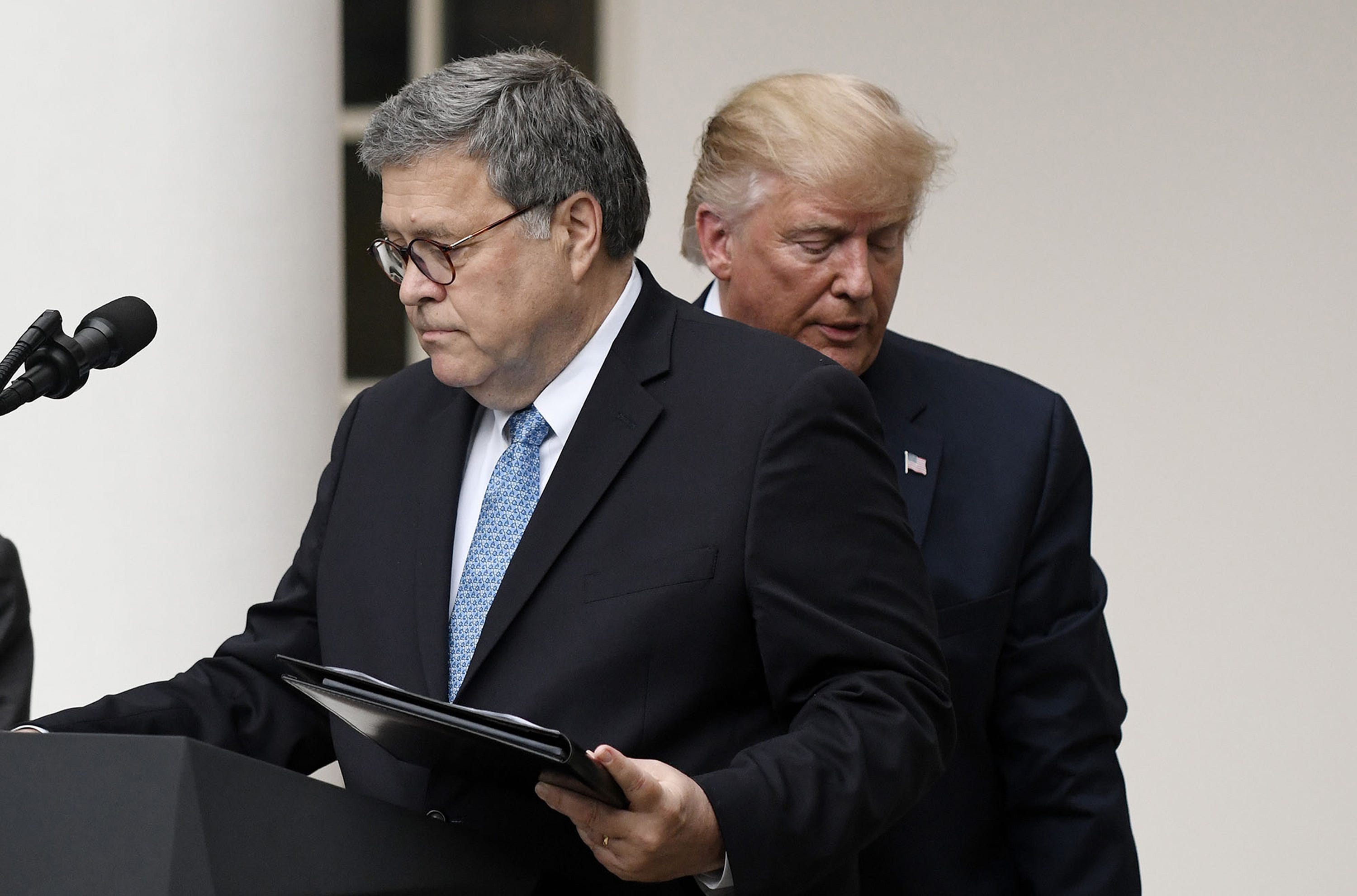 President Donald Trump and U.S. Attorney General William Barr look on during a news conference in the Rose Garden at the White House on July 11, 2019, in Washington, D.C. (Olivier Douliery/Abaca Press/TNS)