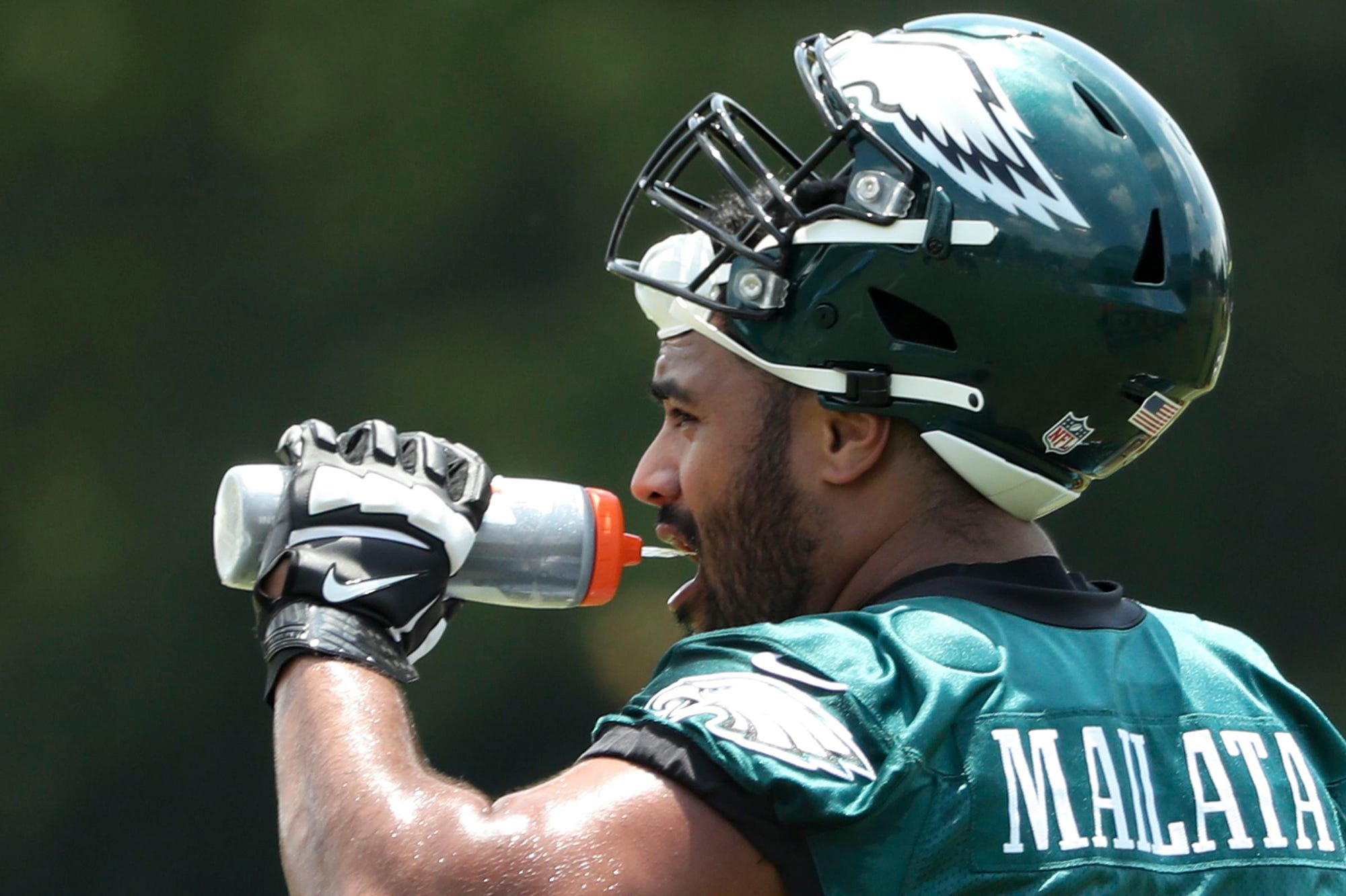 Philadelphia Eagles offensive tackle Jordan Mailata gets water during OTAs at the NovaCare Complex on June 8, 2022, in Philadelphia. (Heather Khalifa/The Philadelphia Inquirer/TNS)