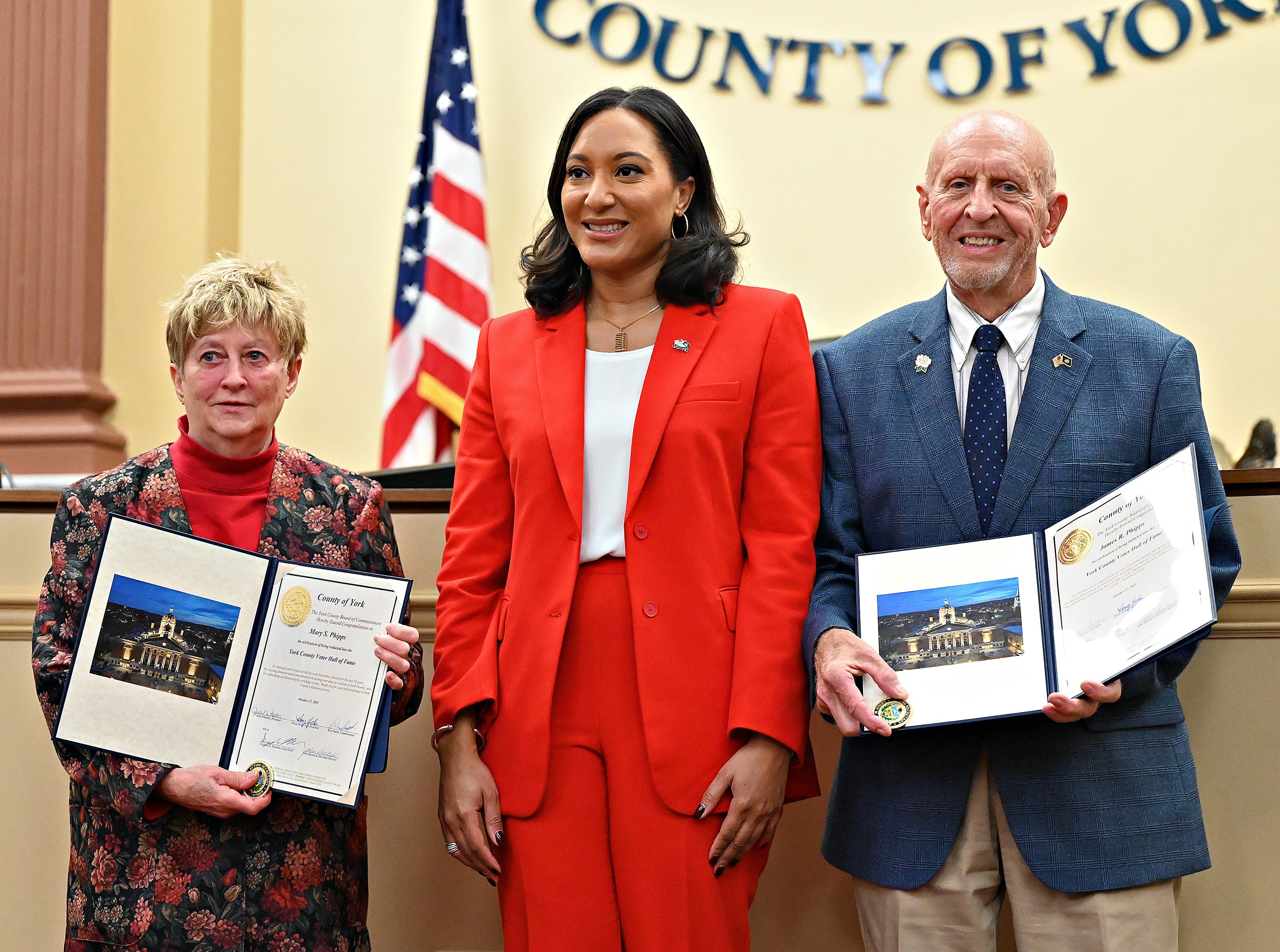 Mary Phipps, left, and James Phipps, right, both of York Township, are photographed with Acting Secretary of State Leigh Chapman following a ceremony held to induct them and three other York County residents into the Pennsylvania Voter Hall of Fame at York County Administrative Center in York City, Monday, Oct. 17, 2022. Recipients have voted in at least 50 consecutive general elections. Dawn J. Sagert/The York Dispatch