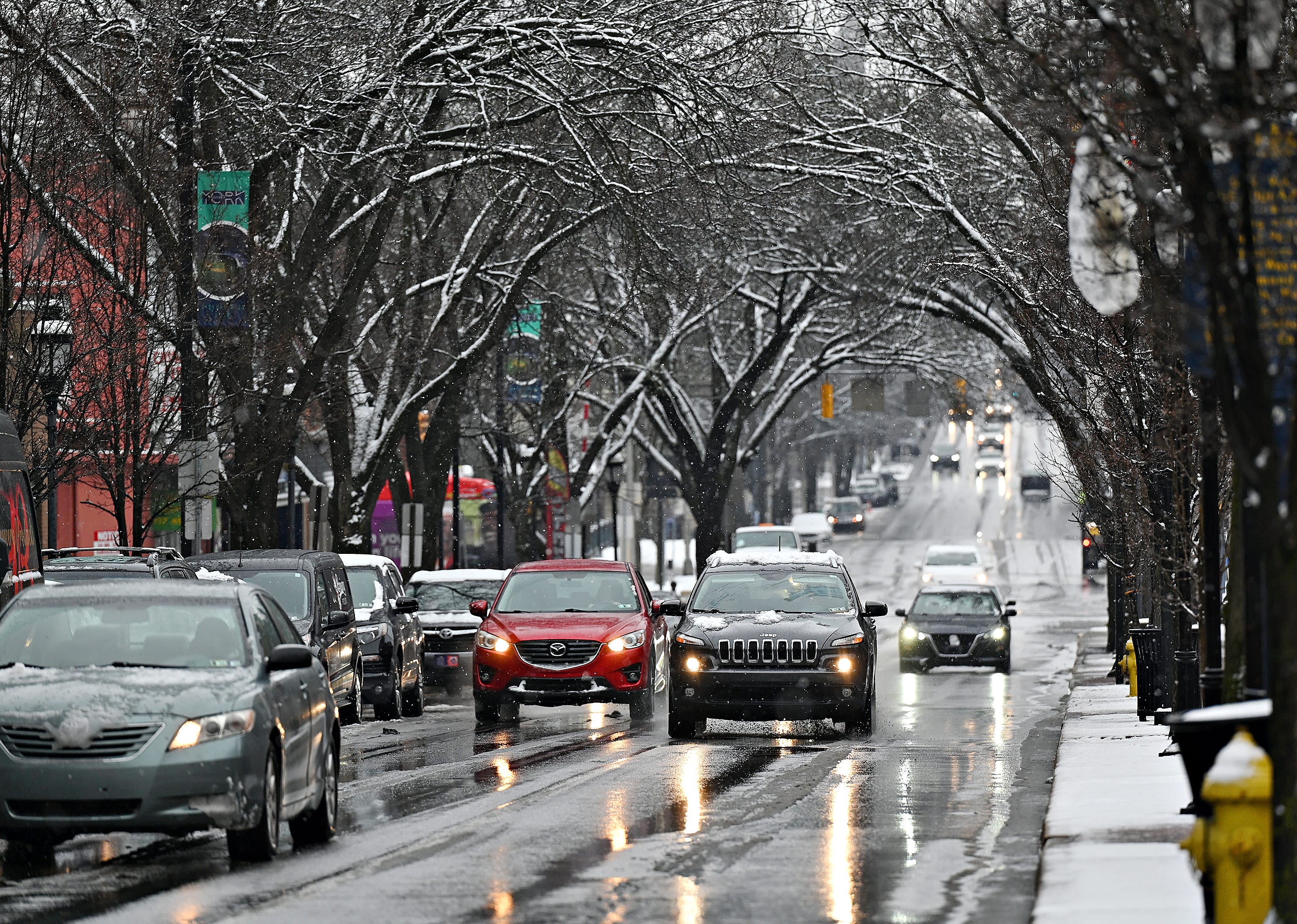 Snow melts on West Market Street in York City, Wednesday, Jan. 25, 2023. Dawn J. Sagert photo