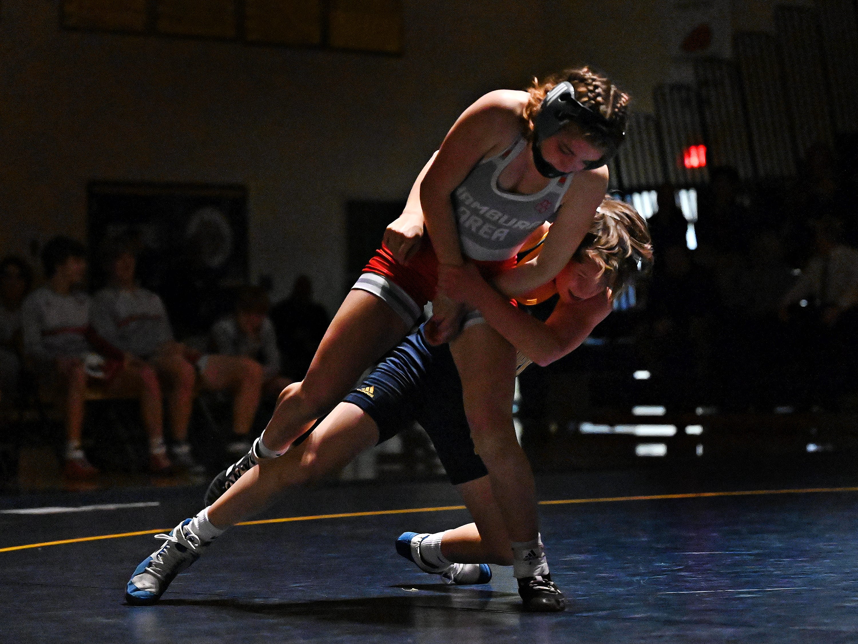Eastern York’s Brock Adams, back, and Hamburg’s Isabelle Wilkes compete in the 107-pound weight class during PIAA District 3, Class 2-A first round wrestling action at Eastern York High School in Lower Windsor Township, Monday, Jan. 30, 2023. Adams would win the match and Eastern York would win the meet 50-22. Dawn J. Sagert photo
