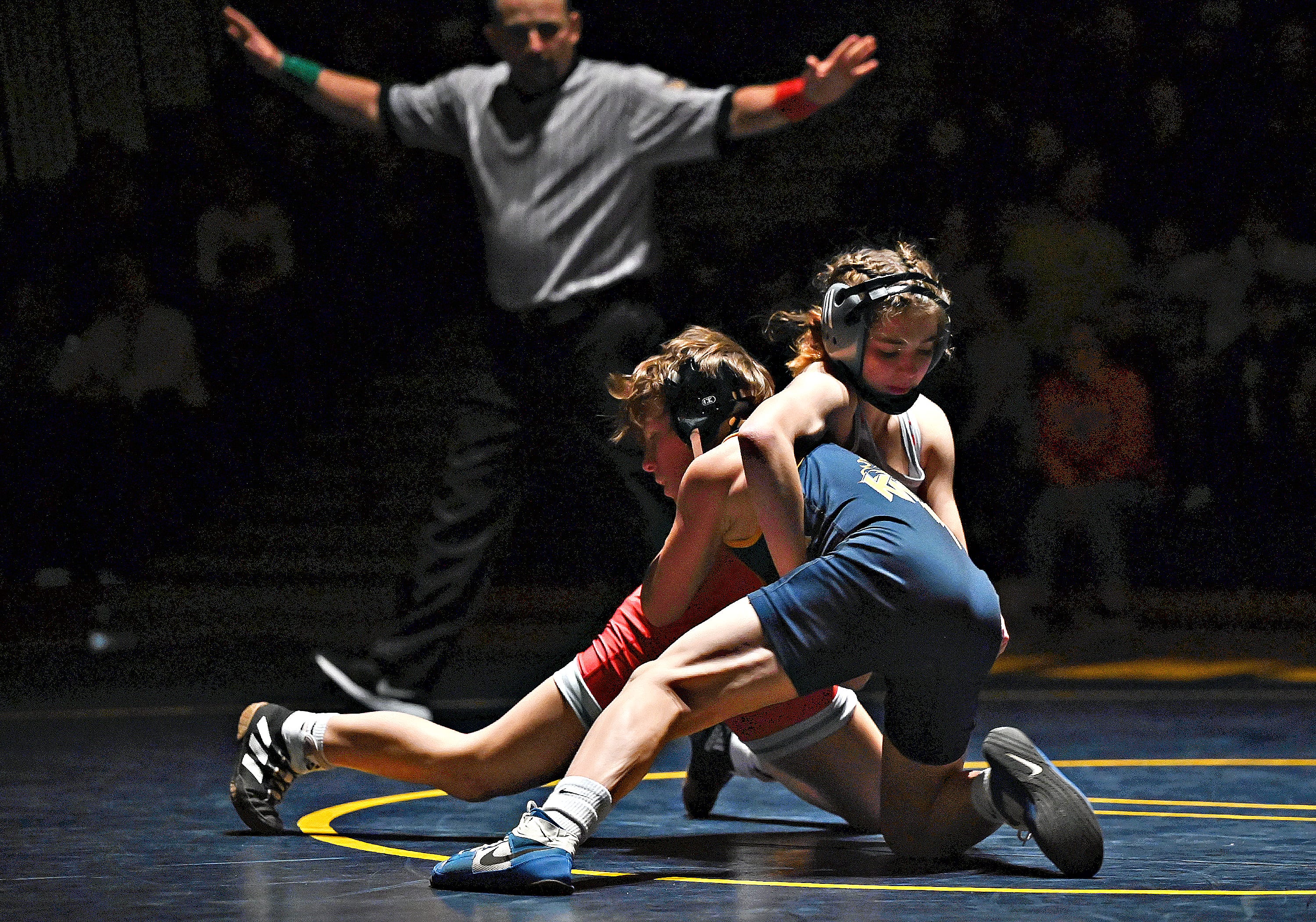 Eastern York’s Brock Adams, front, and Hamburg’s Isabelle Wilkes compete in the 107-pound weight class during PIAA District 3, Class 2-A first round wrestling action at Eastern York High School in Lower Windsor Township, Monday, Jan. 30, 2023. Adams would win the match and Eastern York would win the meet 50-22. Dawn J. Sagert photo