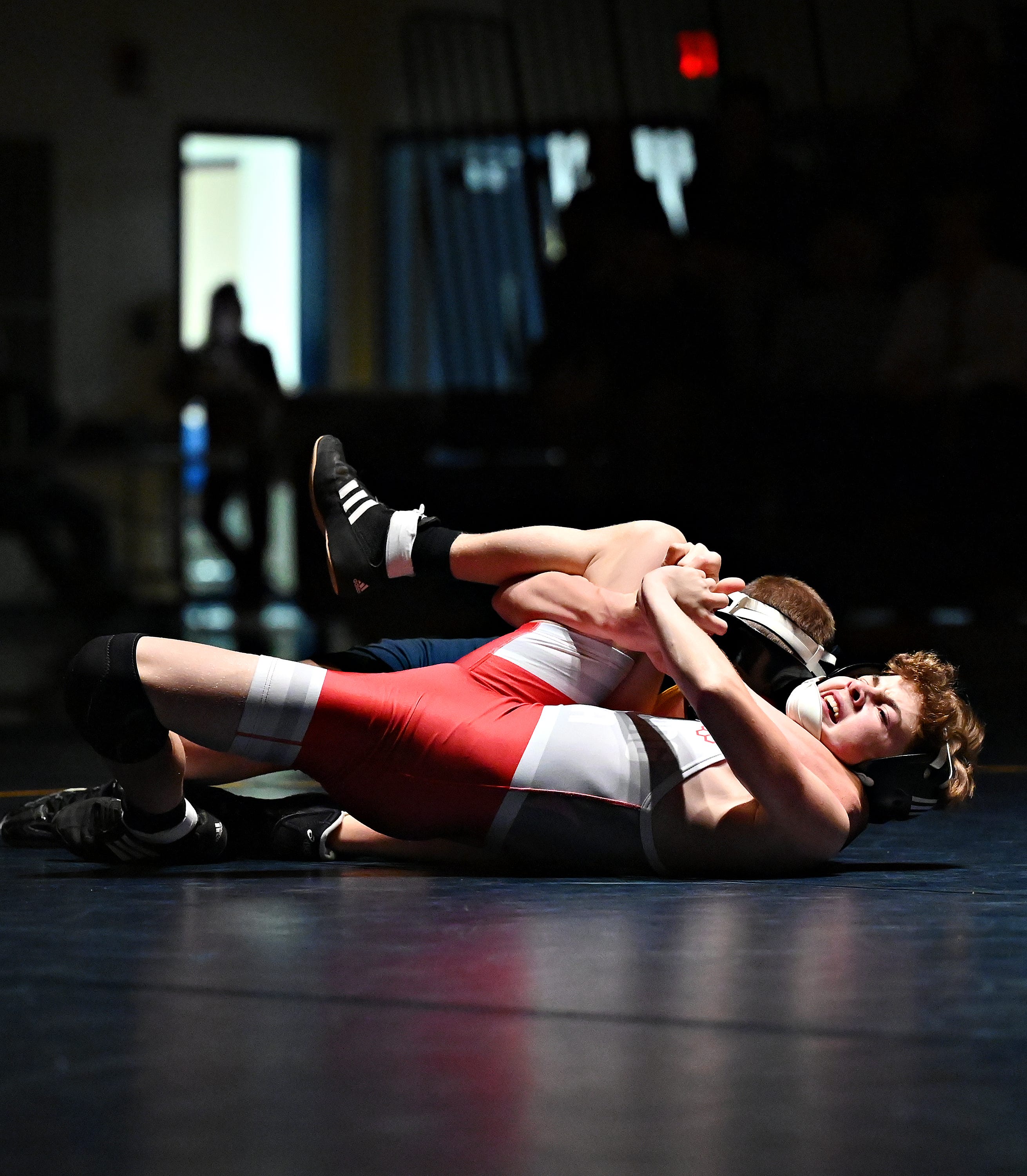 Eastern York’s Isaac Garner, back, and Hamburg’s Chase Denatala compete in the 114-pound weight class during PIAA District 3, Class 2-A first round wrestling action at Eastern York High School in Lower Windsor Township, Monday, Jan. 30, 2023. Garner would win with a pin at 1:30 and Eastern York would win the meet 50-22. Dawn J. Sagert photo