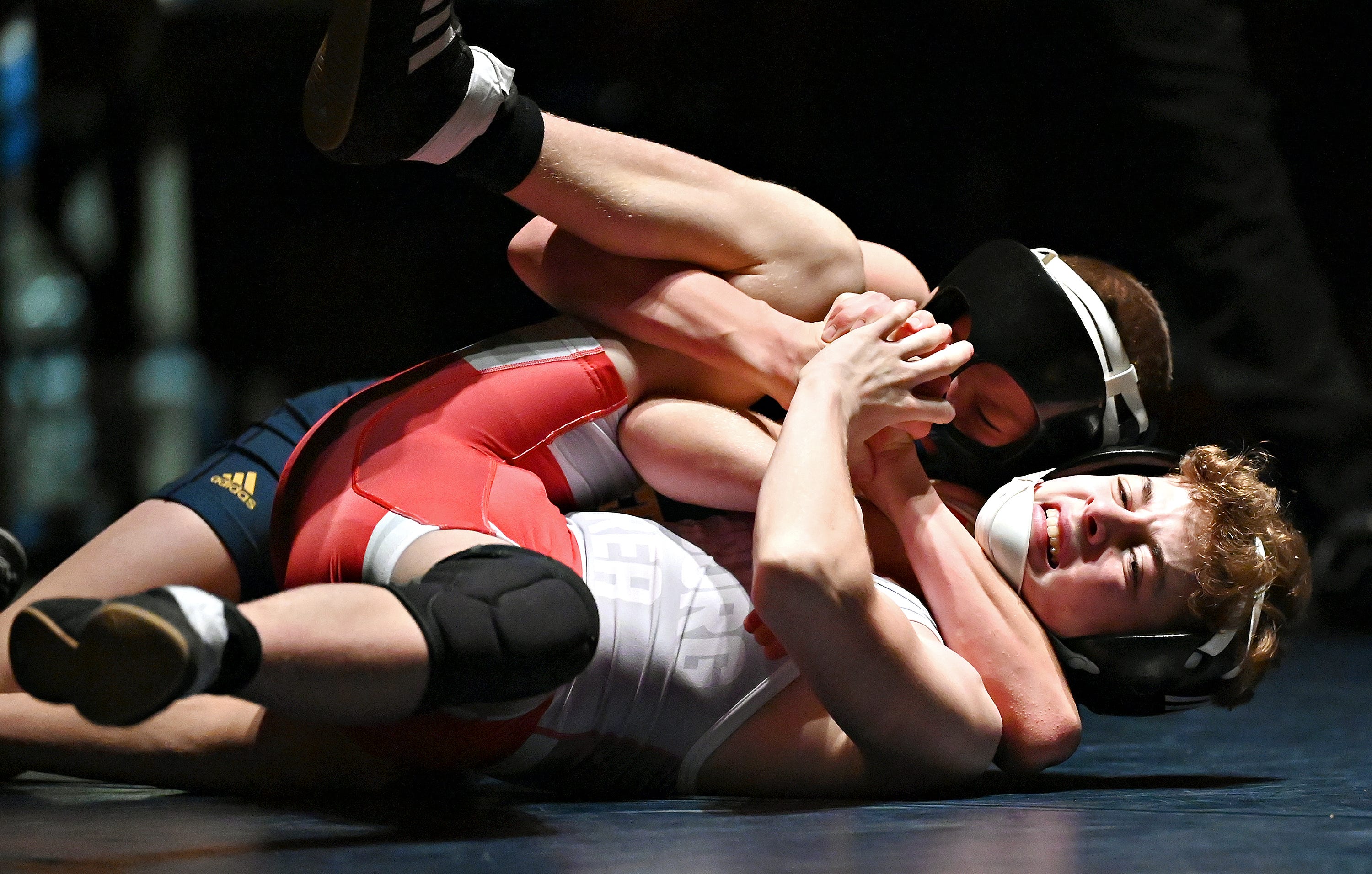 Eastern York’s Isaac Garner, back, and Hamburg’s Chase Denatala compete in the 114-pound weight class during PIAA District 3, Class 2-A first round wrestling action at Eastern York High School in Lower Windsor Township, Monday, Jan. 30, 2023. Garner would win with a pin at 1:30 and Eastern York would win the meet 50-22. Dawn J. Sagert photo