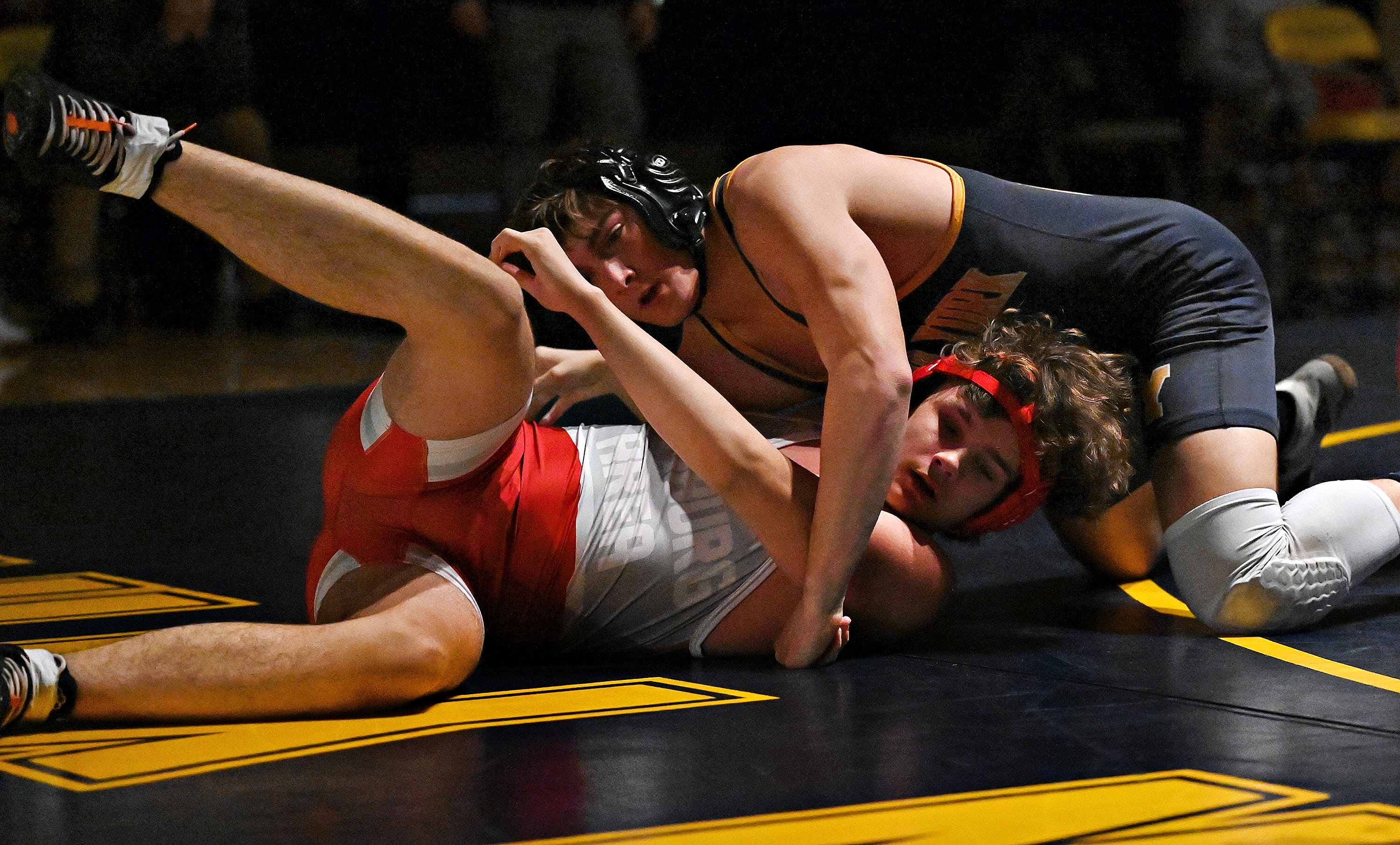 Eastern York’s Cole Staker, back, and Hamburg’s Noah Thebeau compete in the 189-pound weight class during PIAA District 3, Class 2-A first round wrestling action at Eastern York High School in Lower Windsor Township, Monday, Jan. 30, 2023. Staker would win the match and Eastern York would win the meet 50-22. Dawn J. Sagert photo