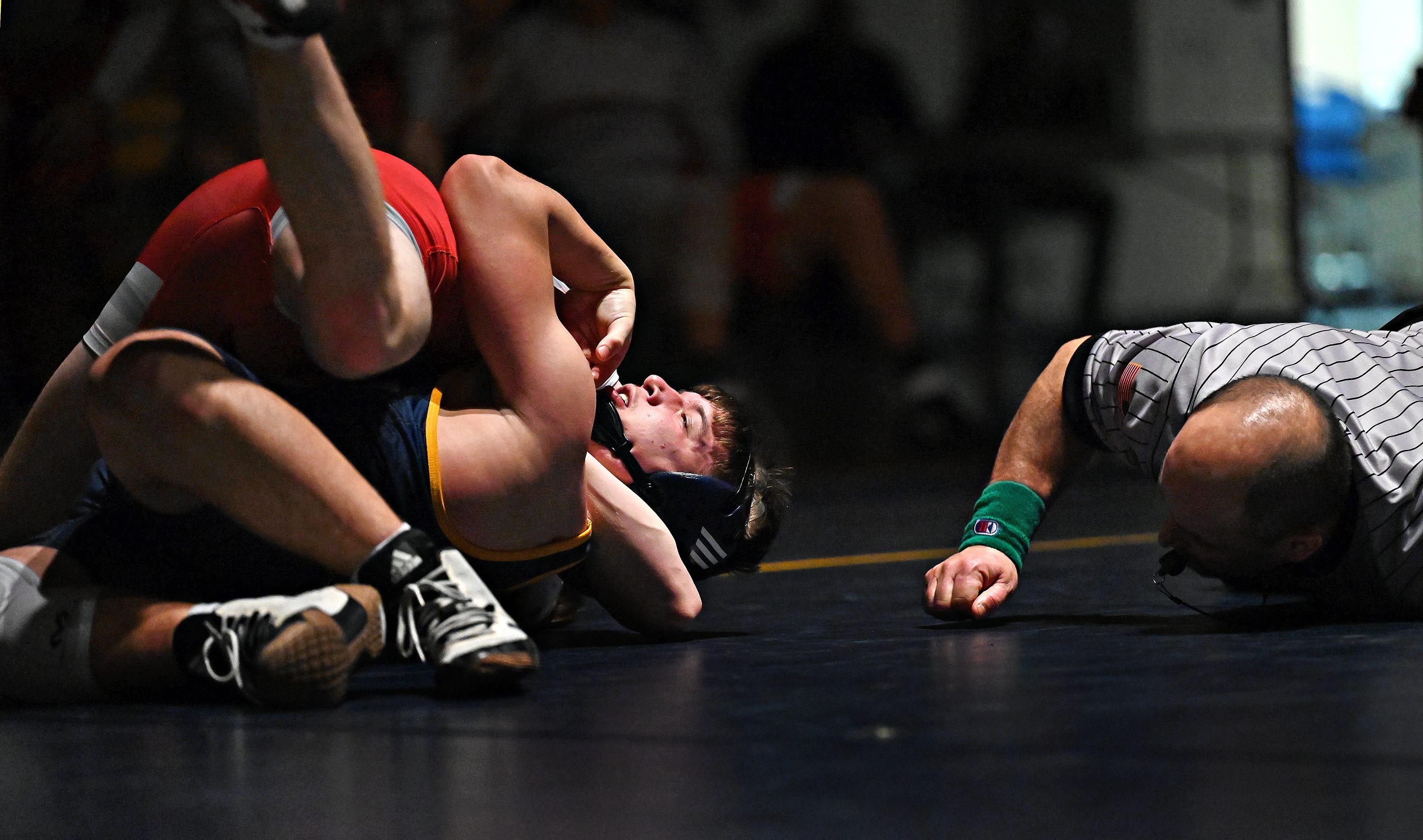 Hamburg’s Cohen Correll, top left, and Eastern York’s Ethan Sgrignoli compete in the 172-pound weight class during PIAA District 3, Class 2-A first round wrestling action at Eastern York High School in Lower Windsor Township, Monday, Jan. 30, 2023. Correll would win the match and Eastern York would win the meet 50-22. Dawn J. Sagert photo